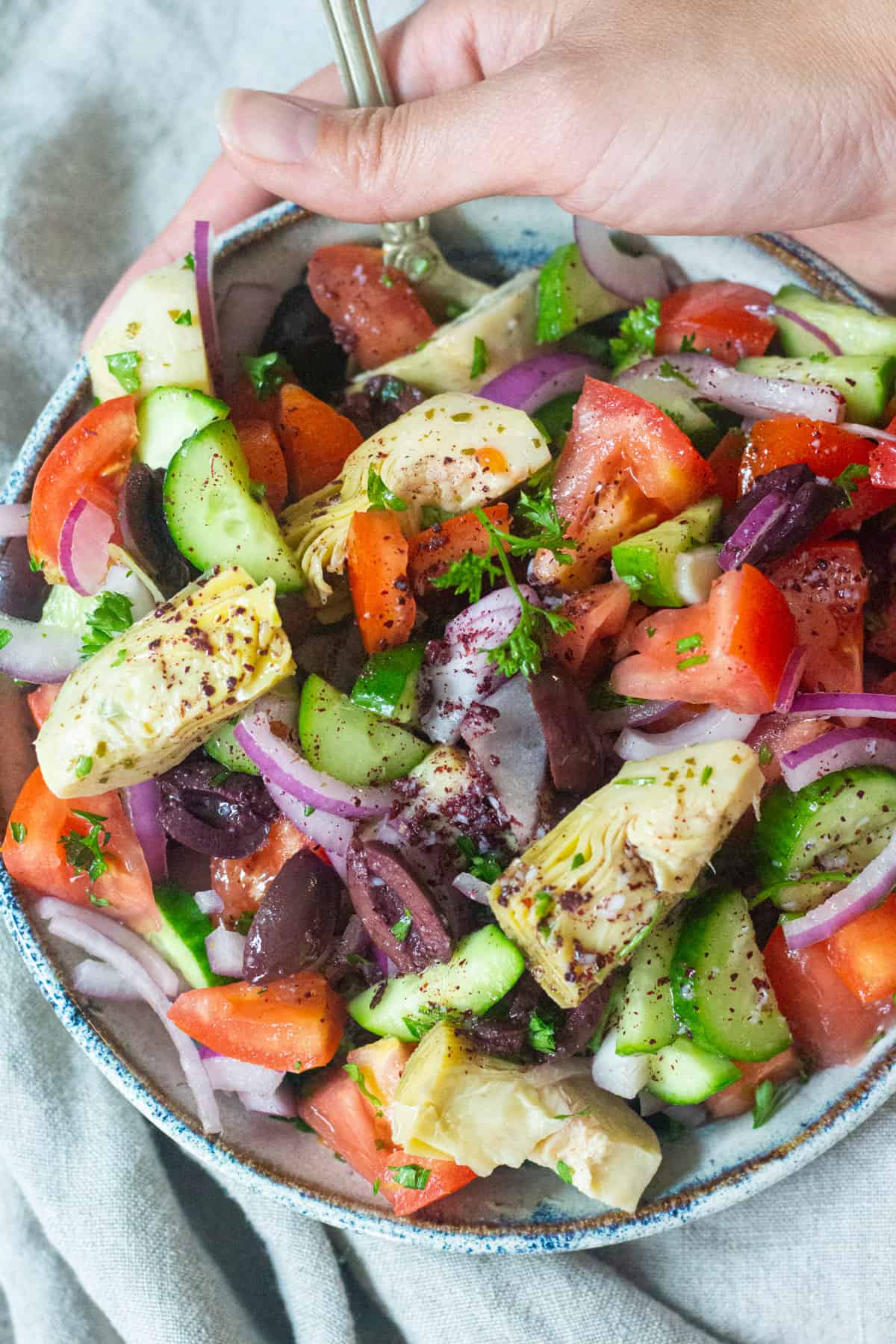 This Mediterranean salad is loaded with fresh vegetables such as cucumbers, tomatoes and herbs. This fresh salad is flavored with a delicious dressing.