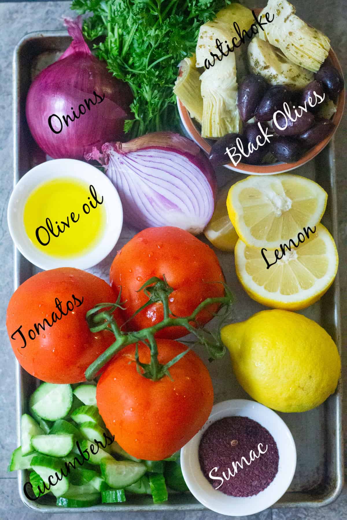 To make Mediterranean cucumber salad you need tomatoes, cucumber, red onion, artichokes, olives, olive oil, sumac and lemon.