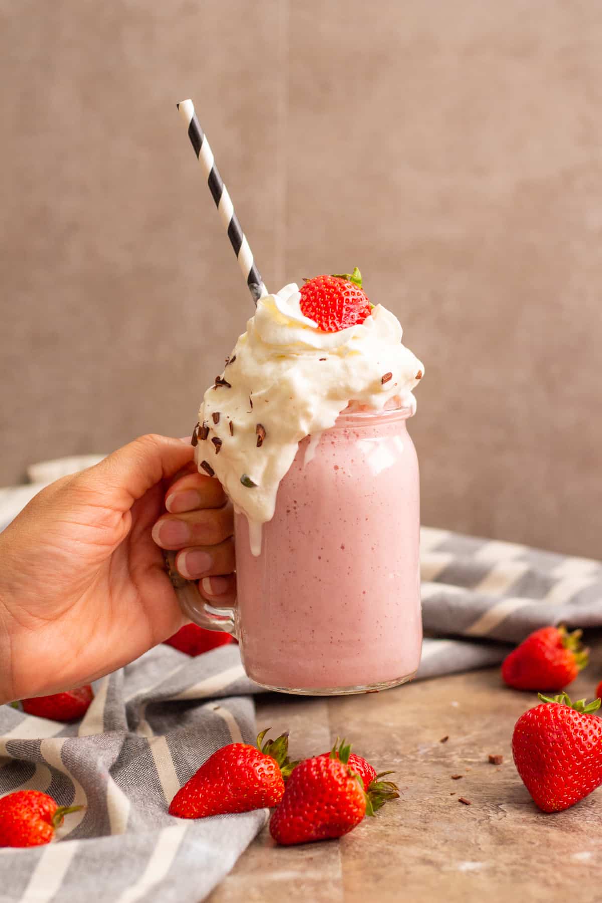 how to make a strawberry milkshake with fresh strawberries and whipped cream. 