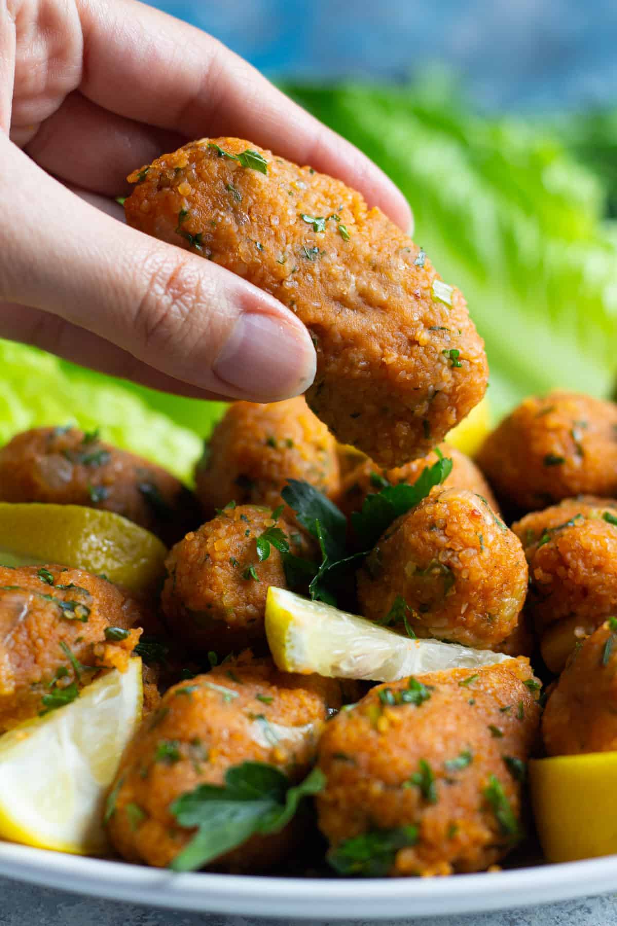These vegan lentil meatballs are a Turkish classic. Made with red lentils and bulgur, these meatballs are usually served with lettuce and herbs. 
