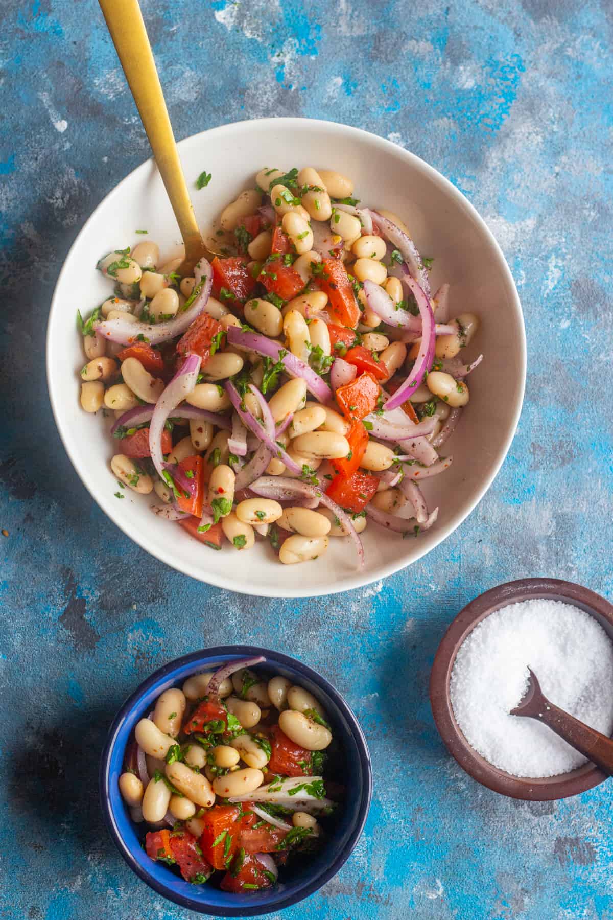 Turkish white bean salad in a  white bowl. 