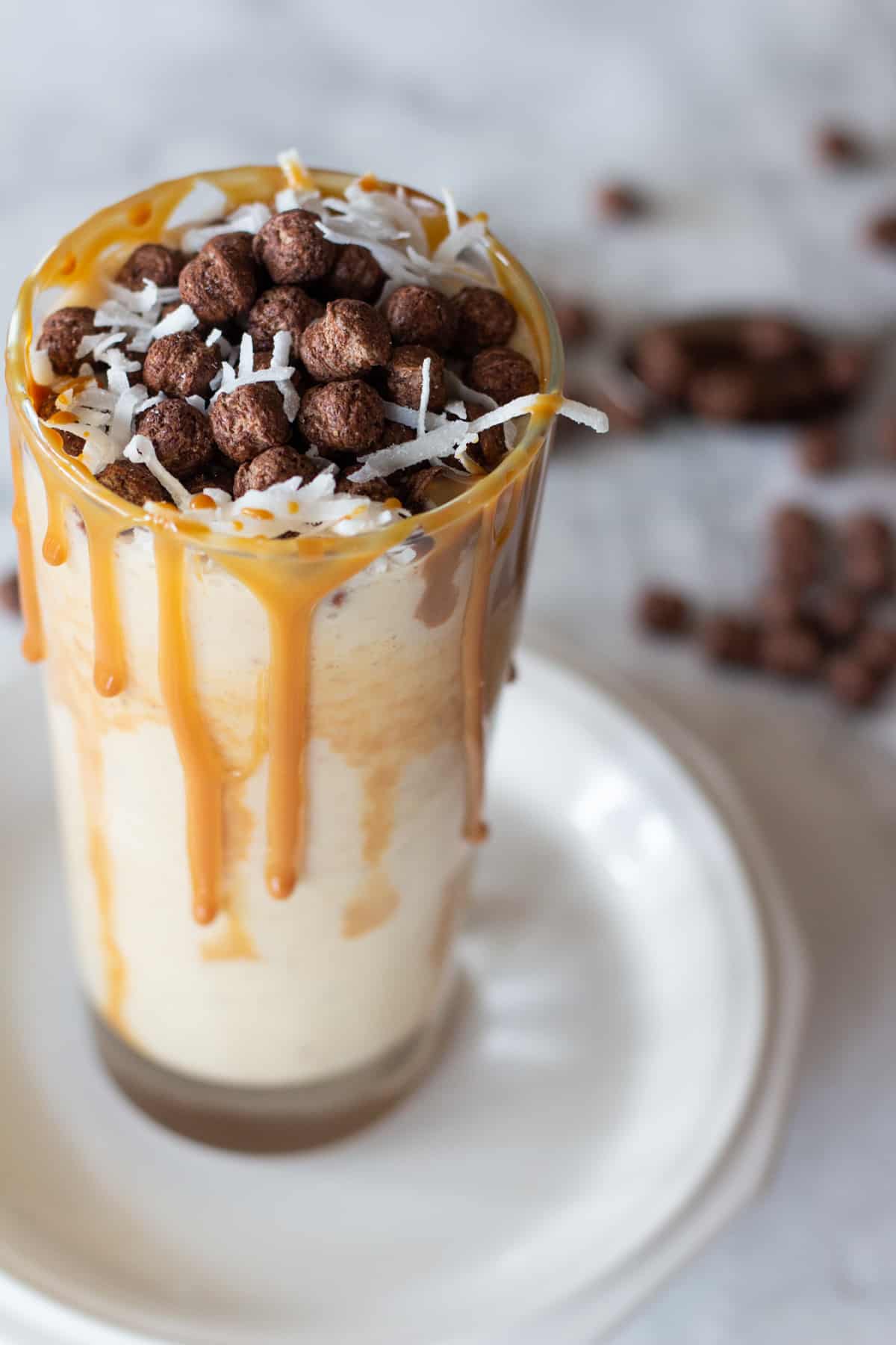 This Banana Peanut Butter Coco Puff Milkshake will make your breakfast more exciting and delicious because it has all the best flavor combinations in one tall glass!