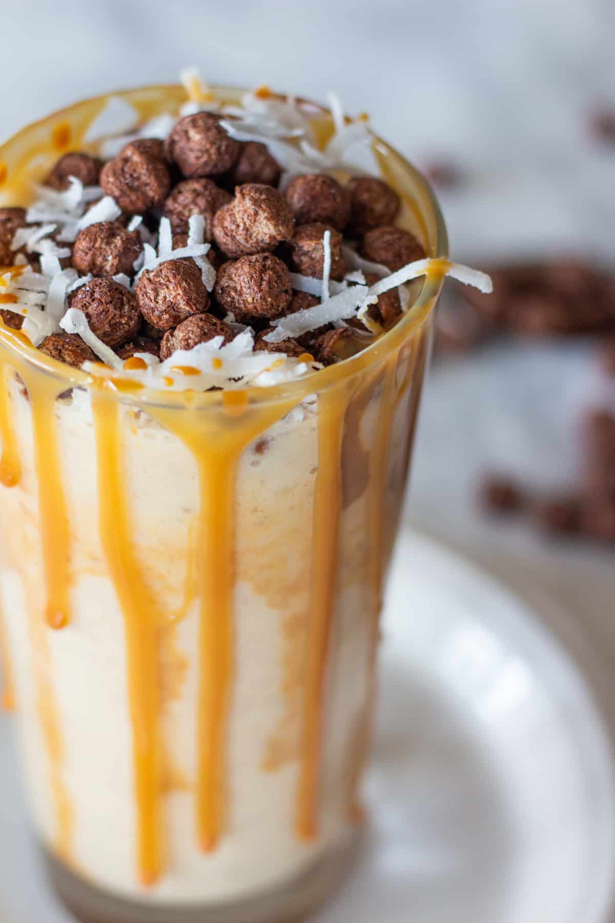 This Banana Peanut Butter Coco Puff Milkshake will make your breakfast more exciting and delicious because it has all the best flavor combinations in one tall glass!