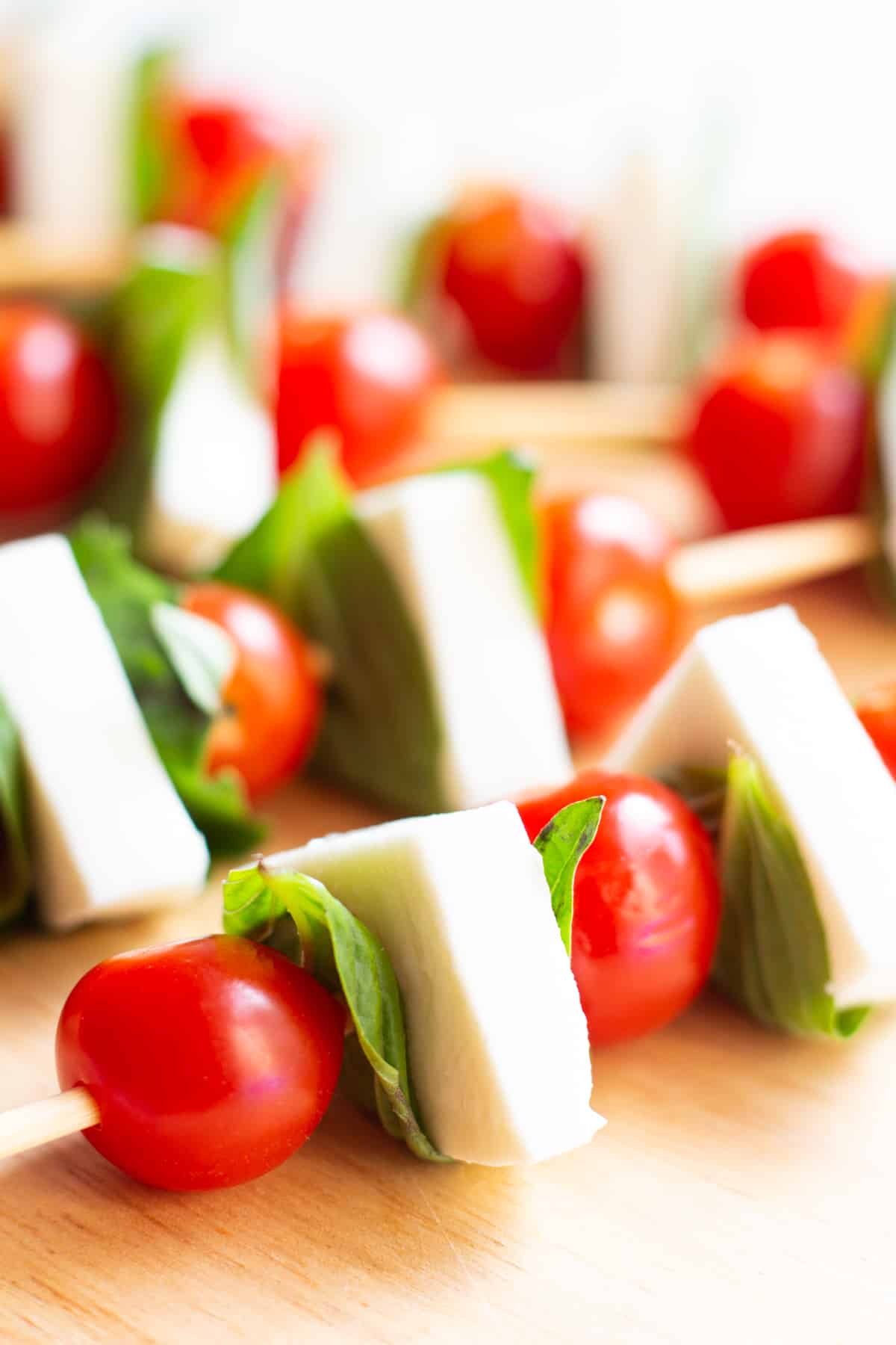 easy mini caprese salad skewers are the perfect appetizer for parties and gatherings. 