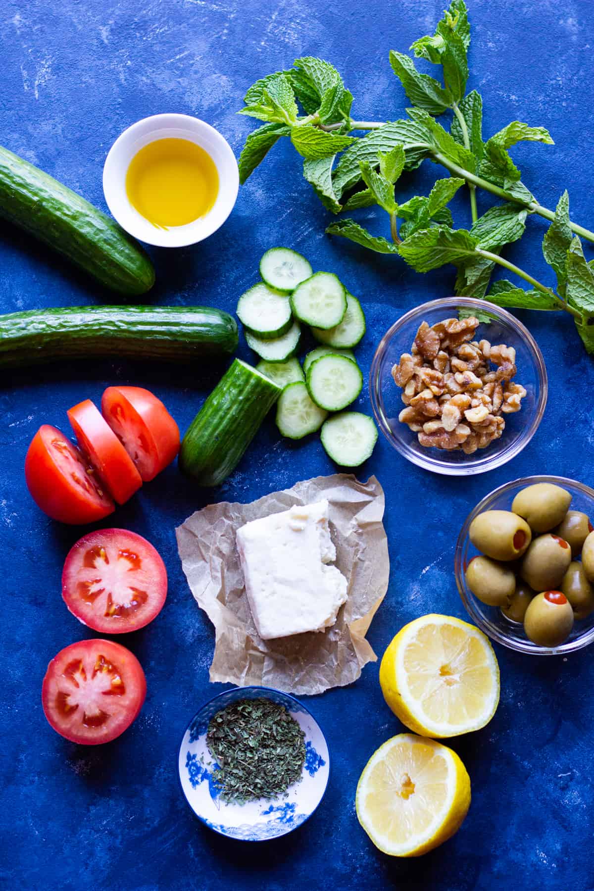 to make this summer salad you need tomatoes, cucumber, mint, olives, walnuts and feta