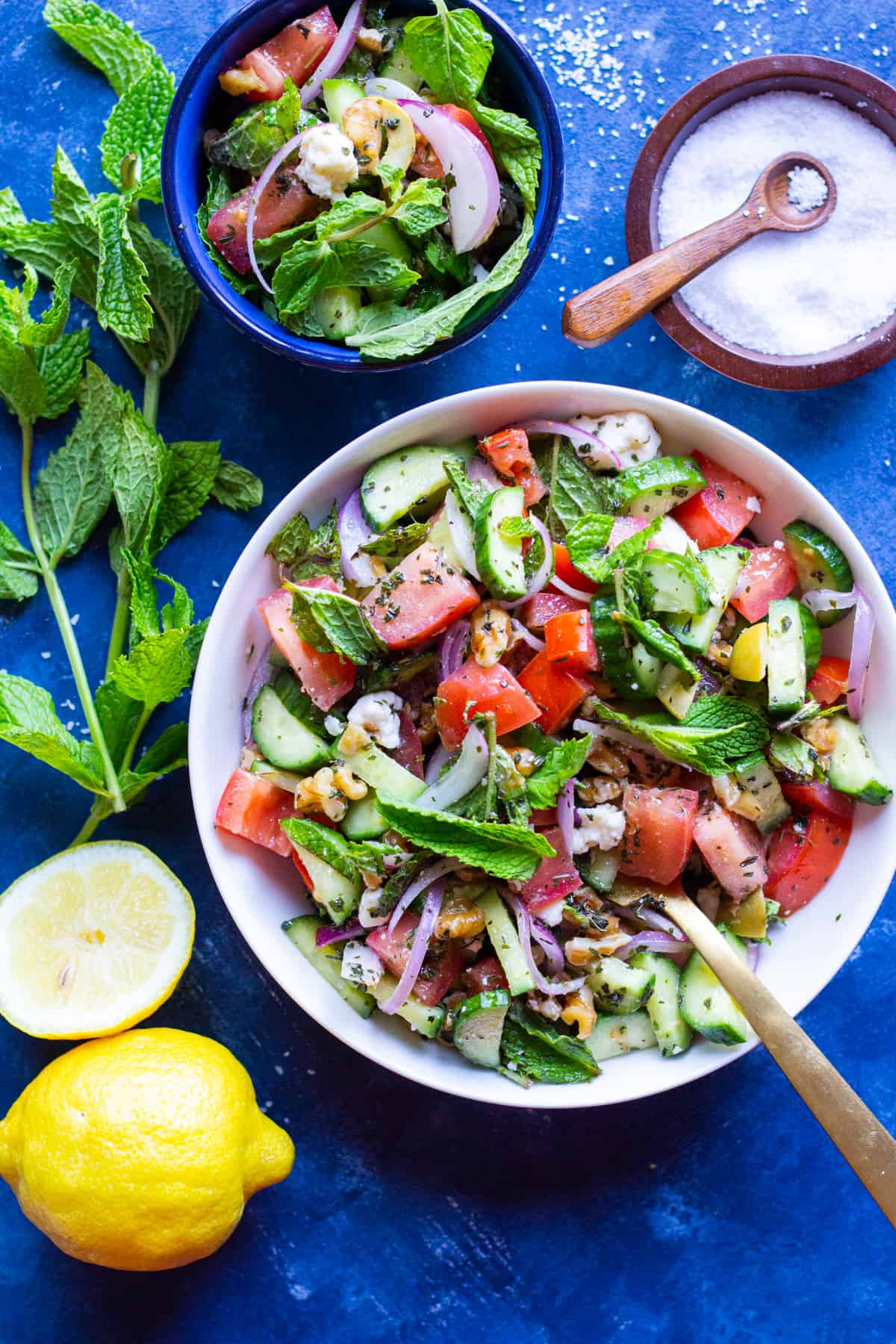 This cucumber tomato feta salad is easy, simple and so delicious. It's made with just a few ingredients and is one of our favorite summer salad recipes.