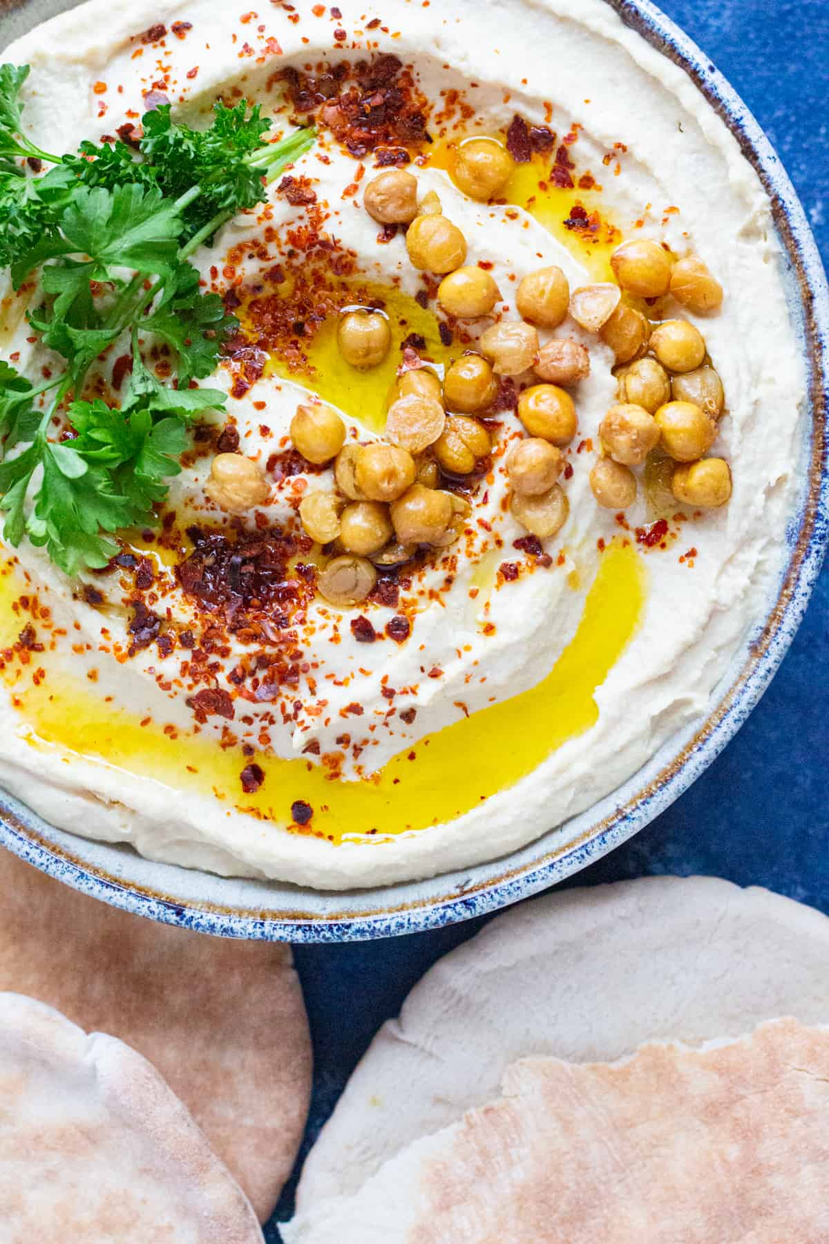 A bowl of Middle Eastern hummus topped with crispy chickpeas. 