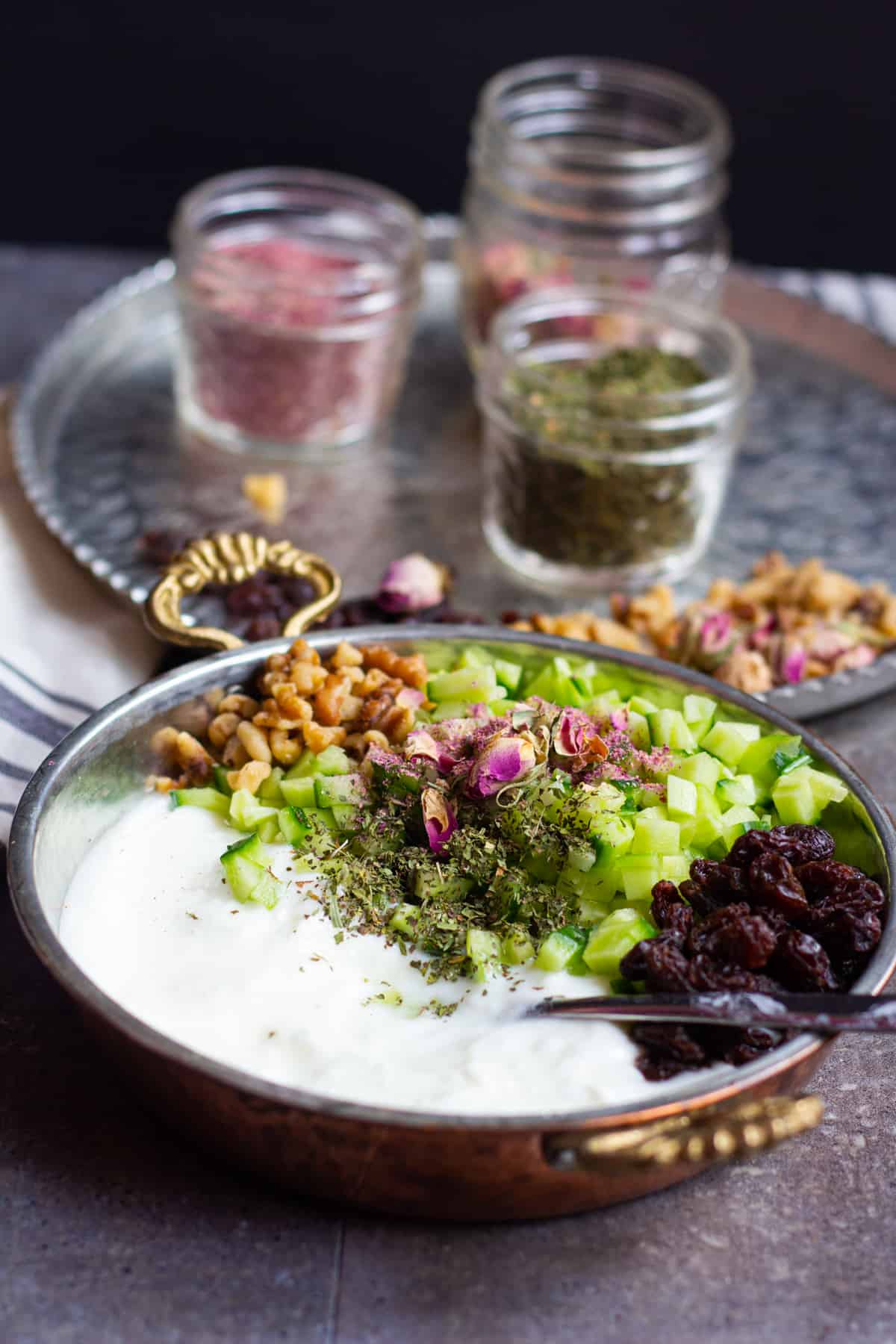 This cucumber dip is flavored with raisins and walnuts. 