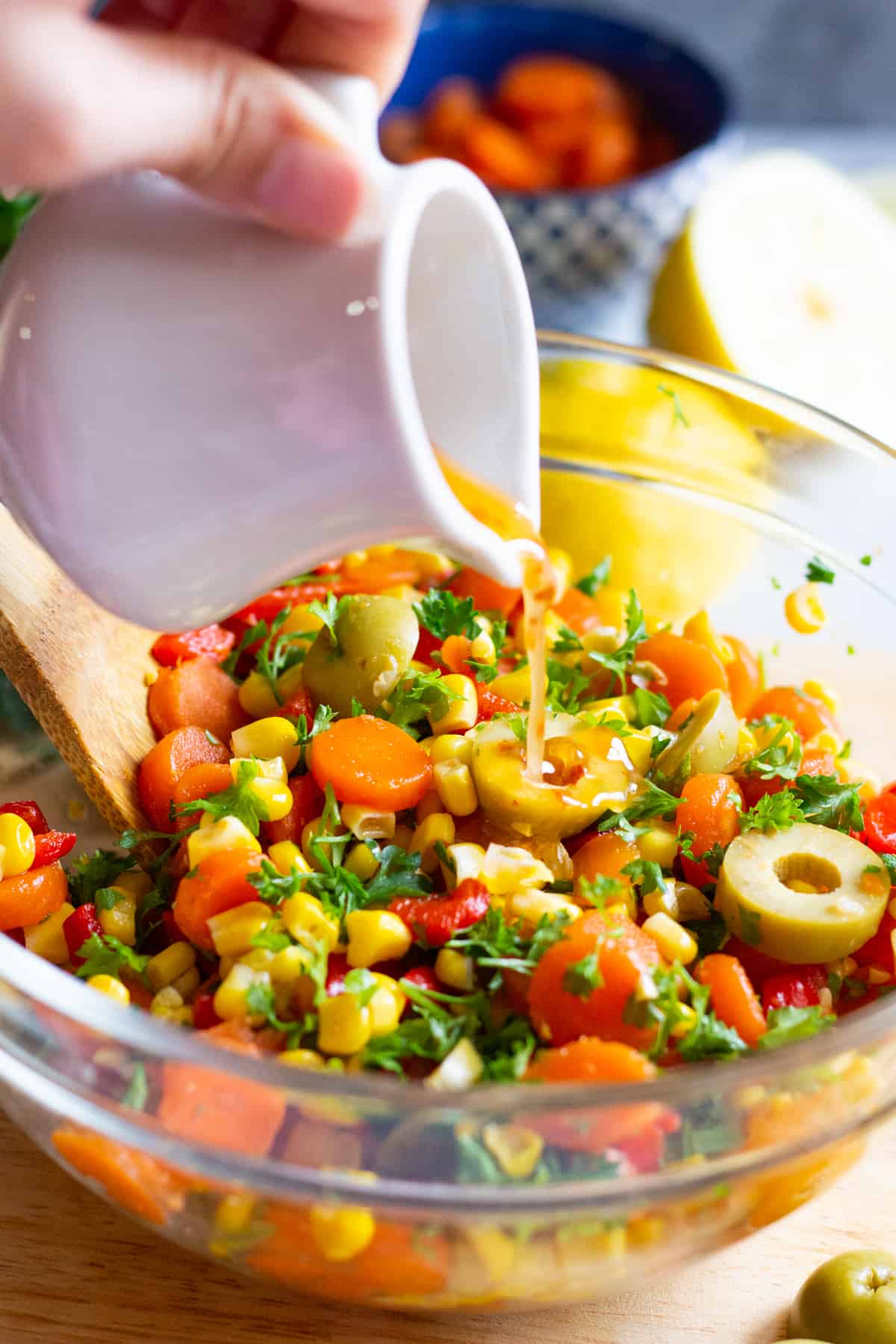 The dressing for this Mediterranean corn salad is made with olive oil, lemon juice, aleppo pepper and salt.