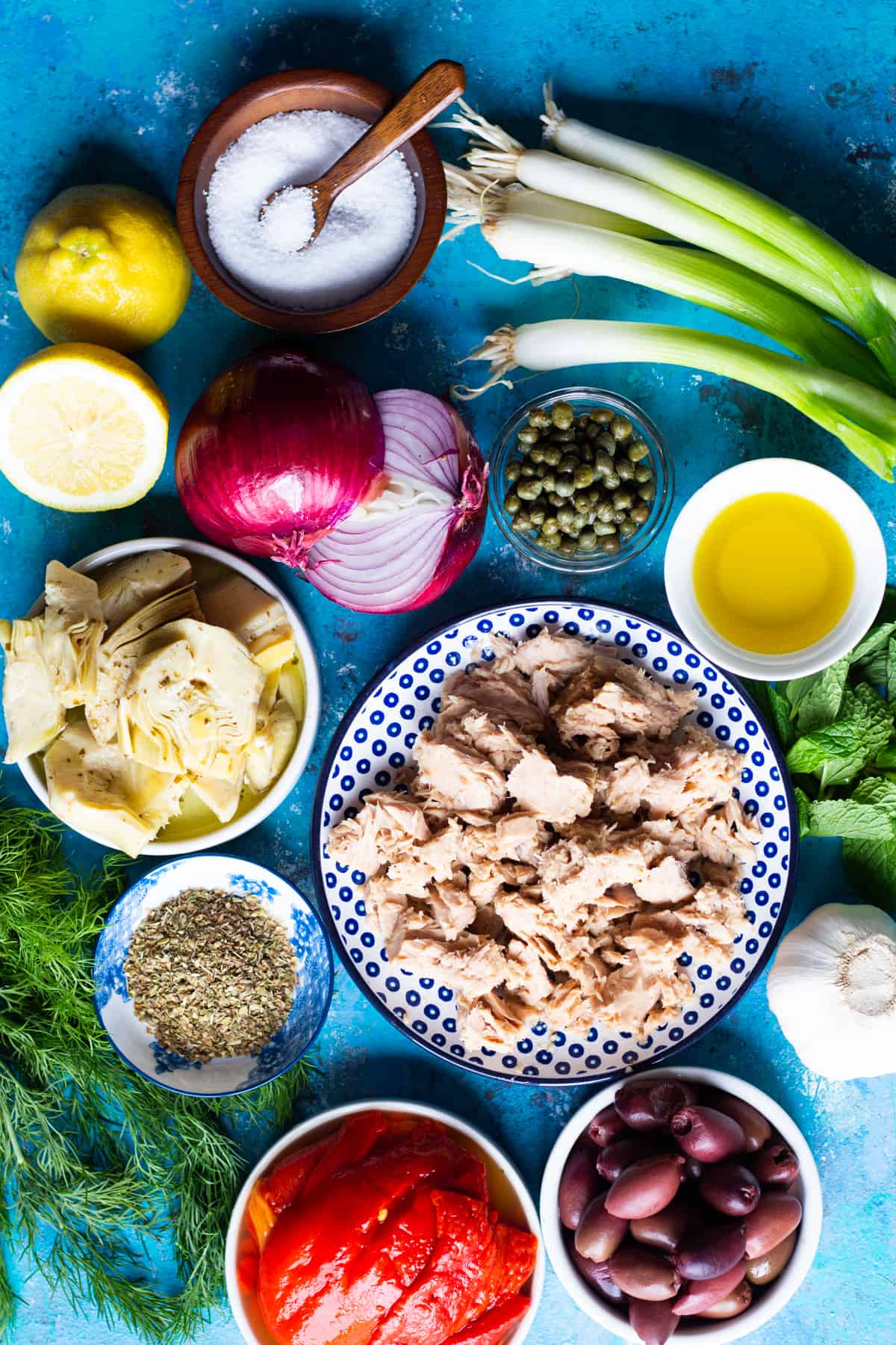 Ingredient shot: tuna, onion, artichokes, herbs, peppers and capers. 