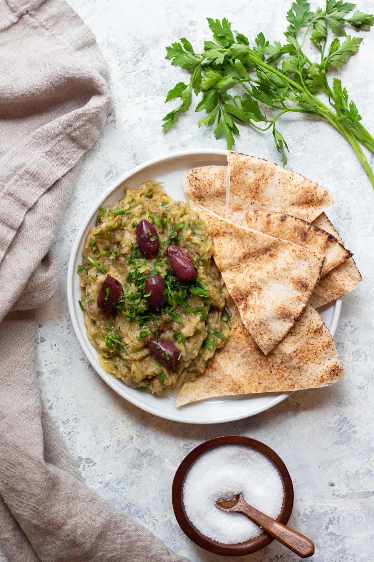 Melitzanosalata is a Greek eggplant dip that's made with eggplant, garlic and lemon juice. You can serve this eggplant appetizer as a part of a mezze platter with some pita. 
