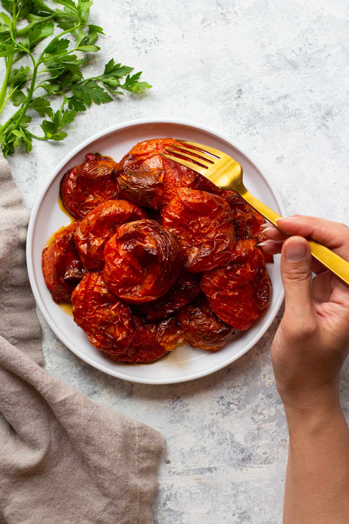 Oven roasted tomatoes are so easy to make and are delightfully delicious. Make them into pasta sauce, or simply serve with a crusty bread. However you serve these roasted tomatoes, they're going to be perfect.