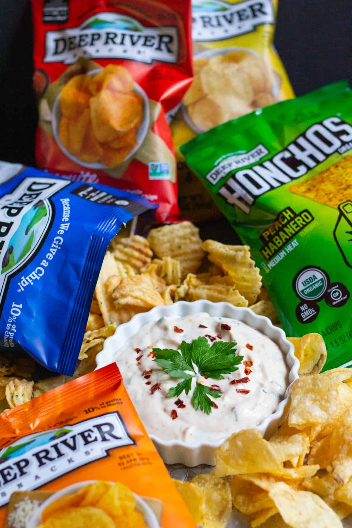 Dip with chips on a background.