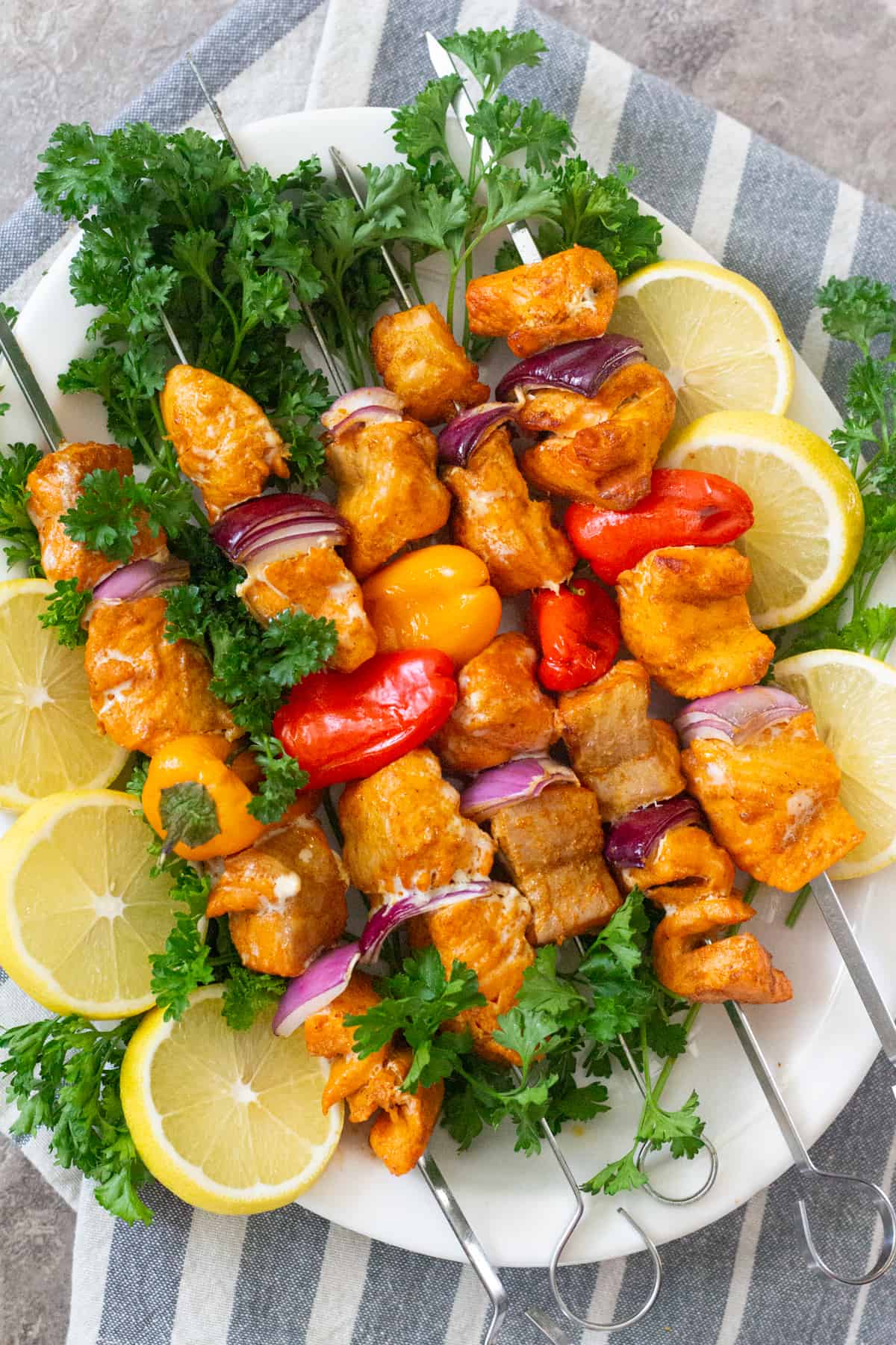 Grilled salmon shish kabobs  are hearty, healthy and delicious. Seasoned with tasty spices, these salmon kabobs are easy to make and packed with tons of flavor. 
