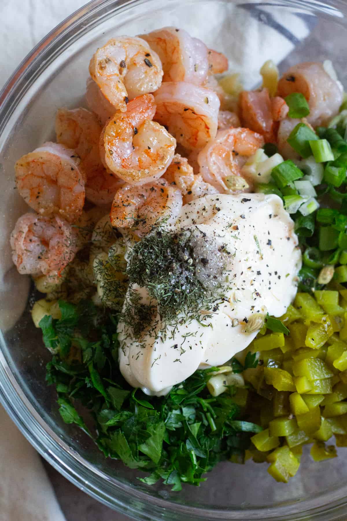 shrimp pasta salad recipe - mix shrimp, parsley, green onion, mayonnaise, dill pickles and spices in a large bowl.