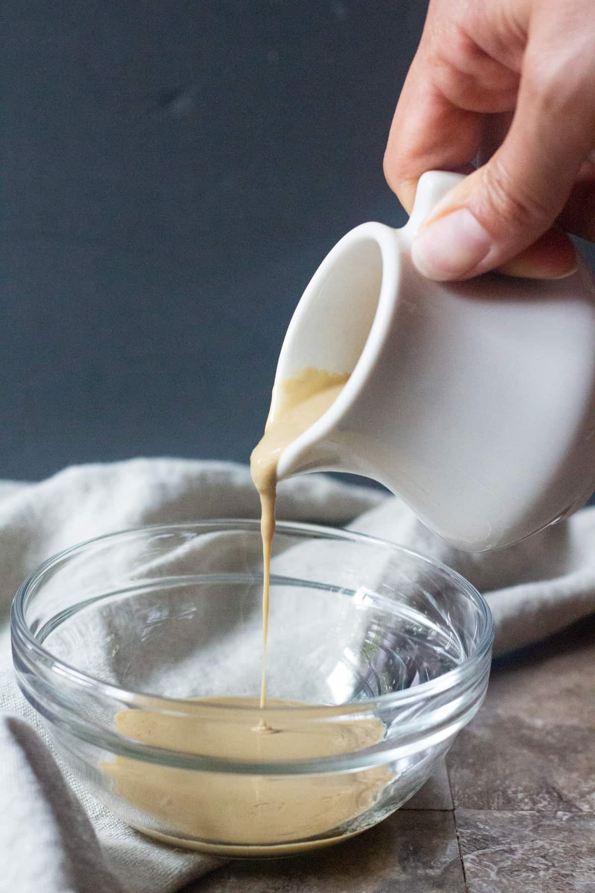 Tahini sauce can be made in a bowl or a mason jar. 