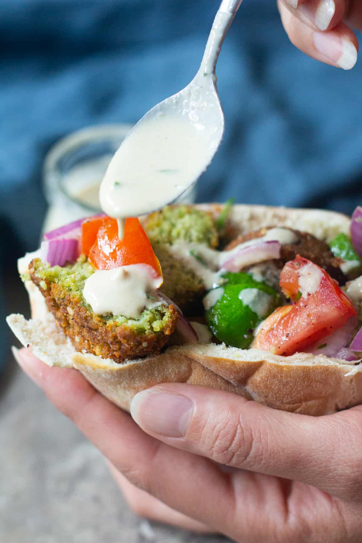 Homemade tahini sauce can be used as a condiment for falafel sandwich. 