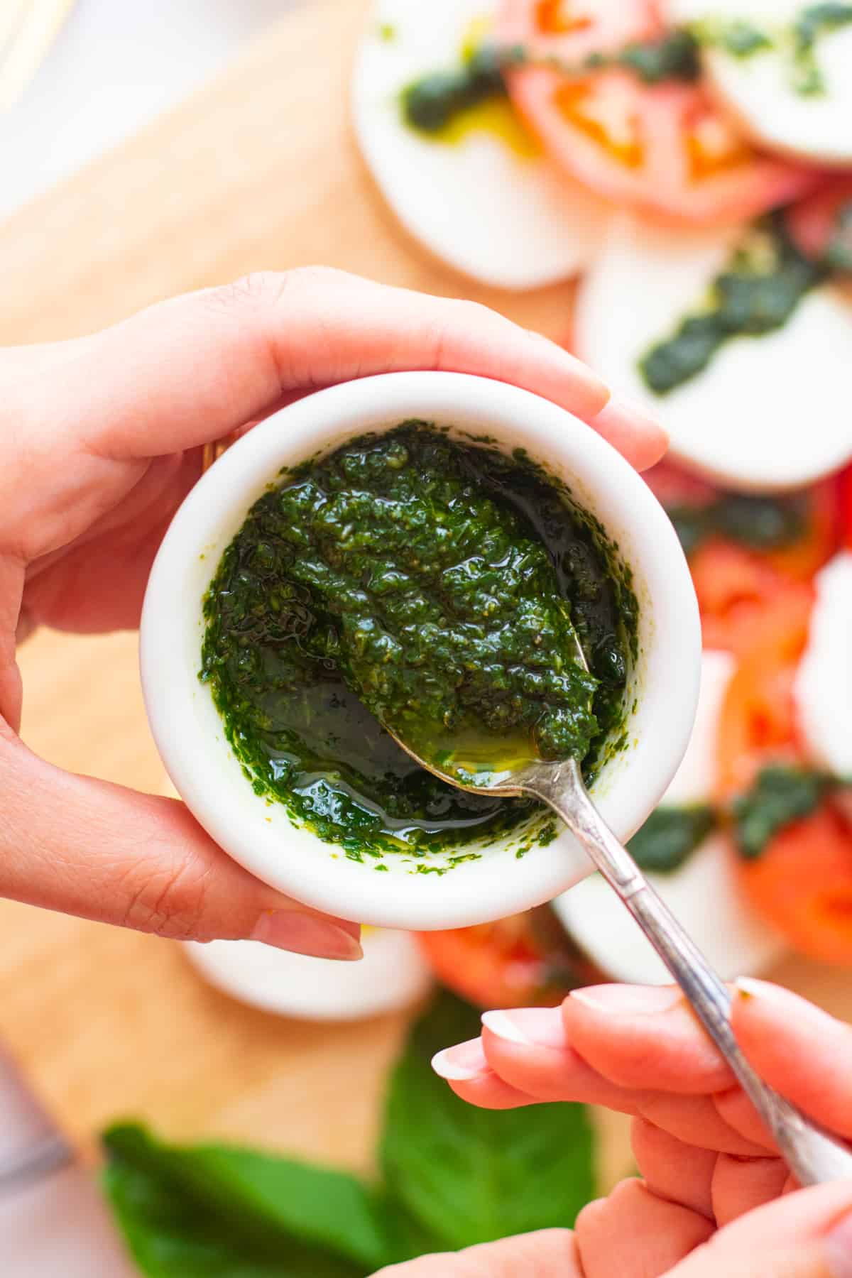 Basil oil is a delicious condiment that you can use on salads, chicken, fish or sandwiches. It's vegan, gluten free, dairy free and Whole30 approved. 
