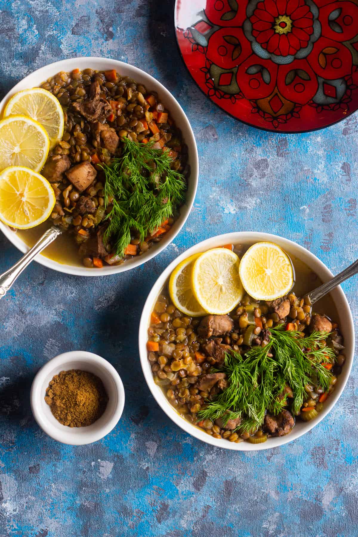 Serve chicken lentil soup with fresh dill and lemon.