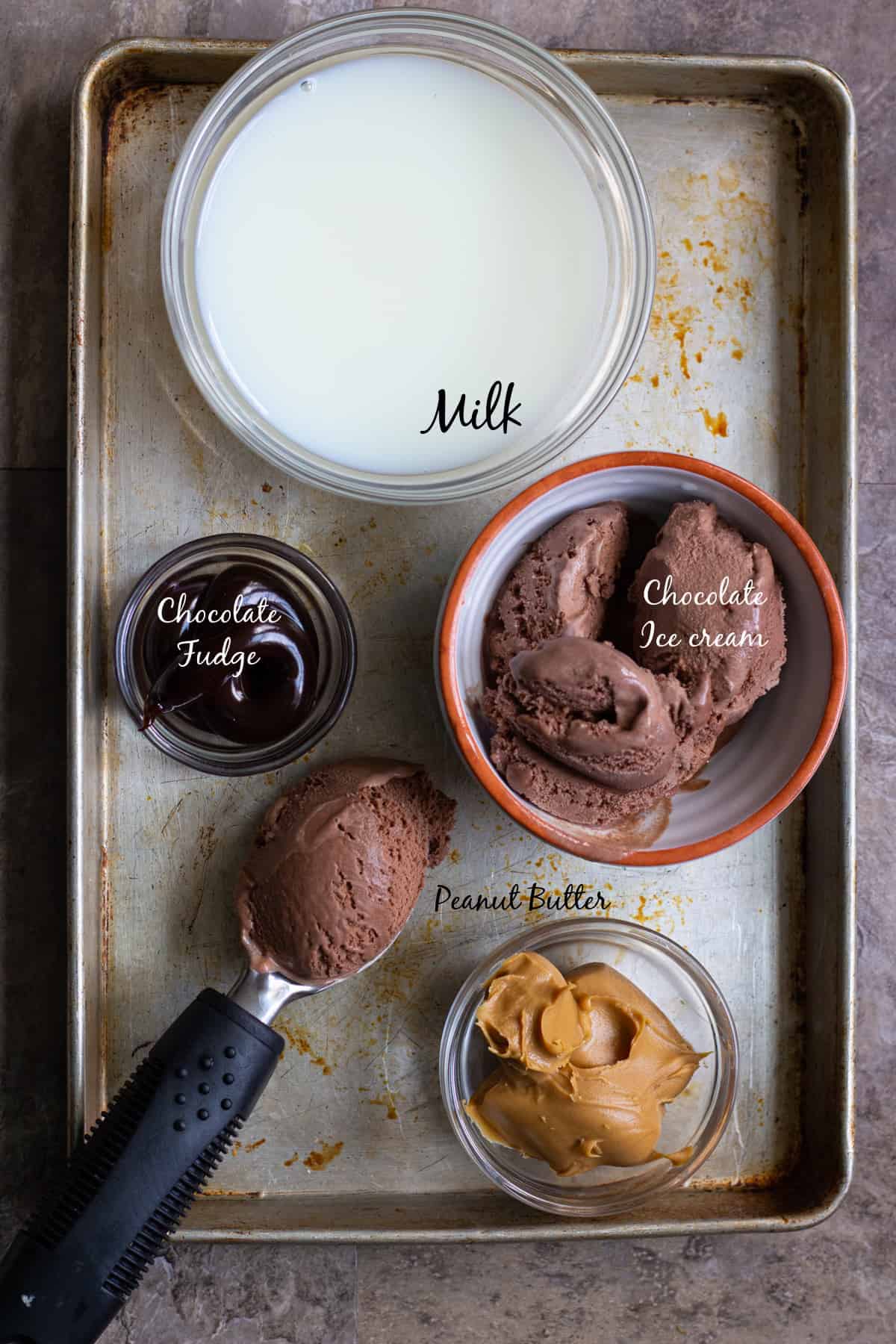 chocolate milkshake ingredients are chocolate ice cream, hot fudge sauce, milk and peanut butter
