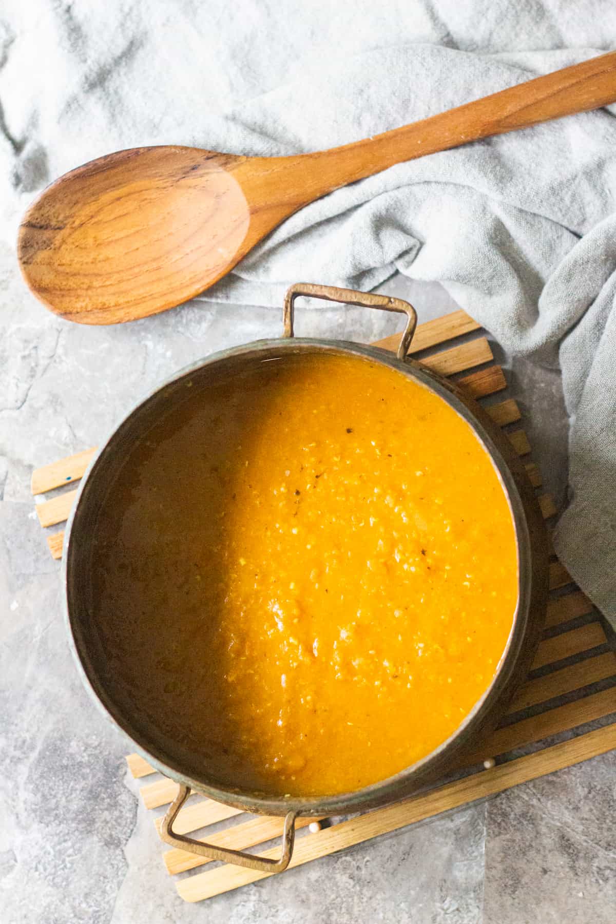 To make curry red lentil soup cook the lentils with onion and garlic until they're tender.