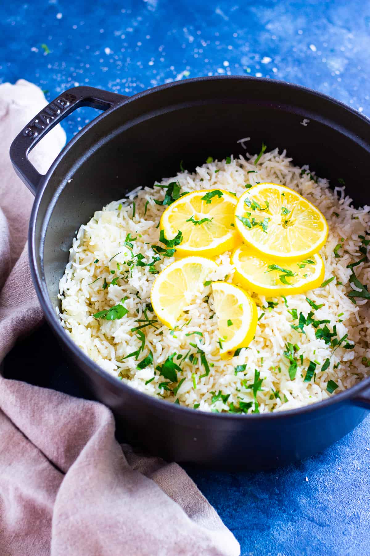 Rice in a pot with lemon and parsley. 
