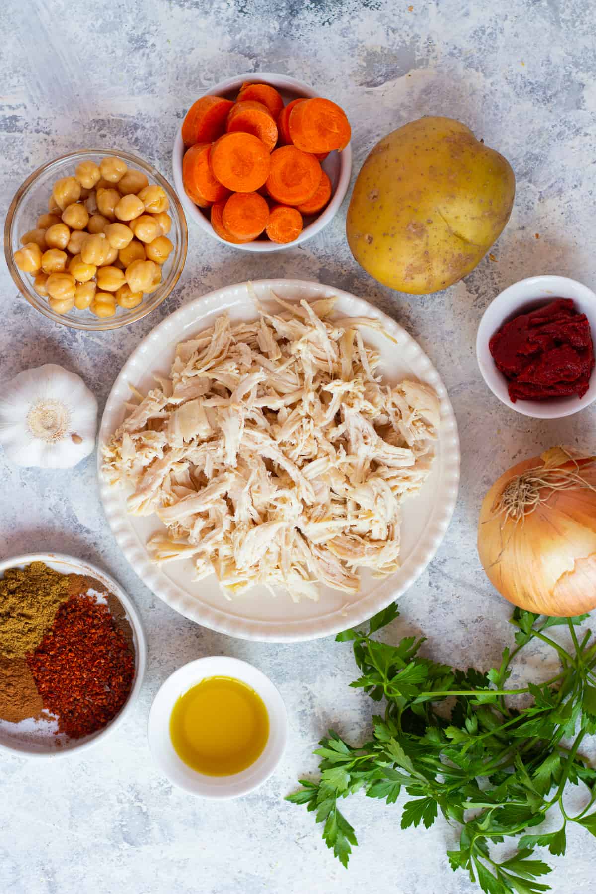 three bowls of chicken soup made with middle eastern spices. 