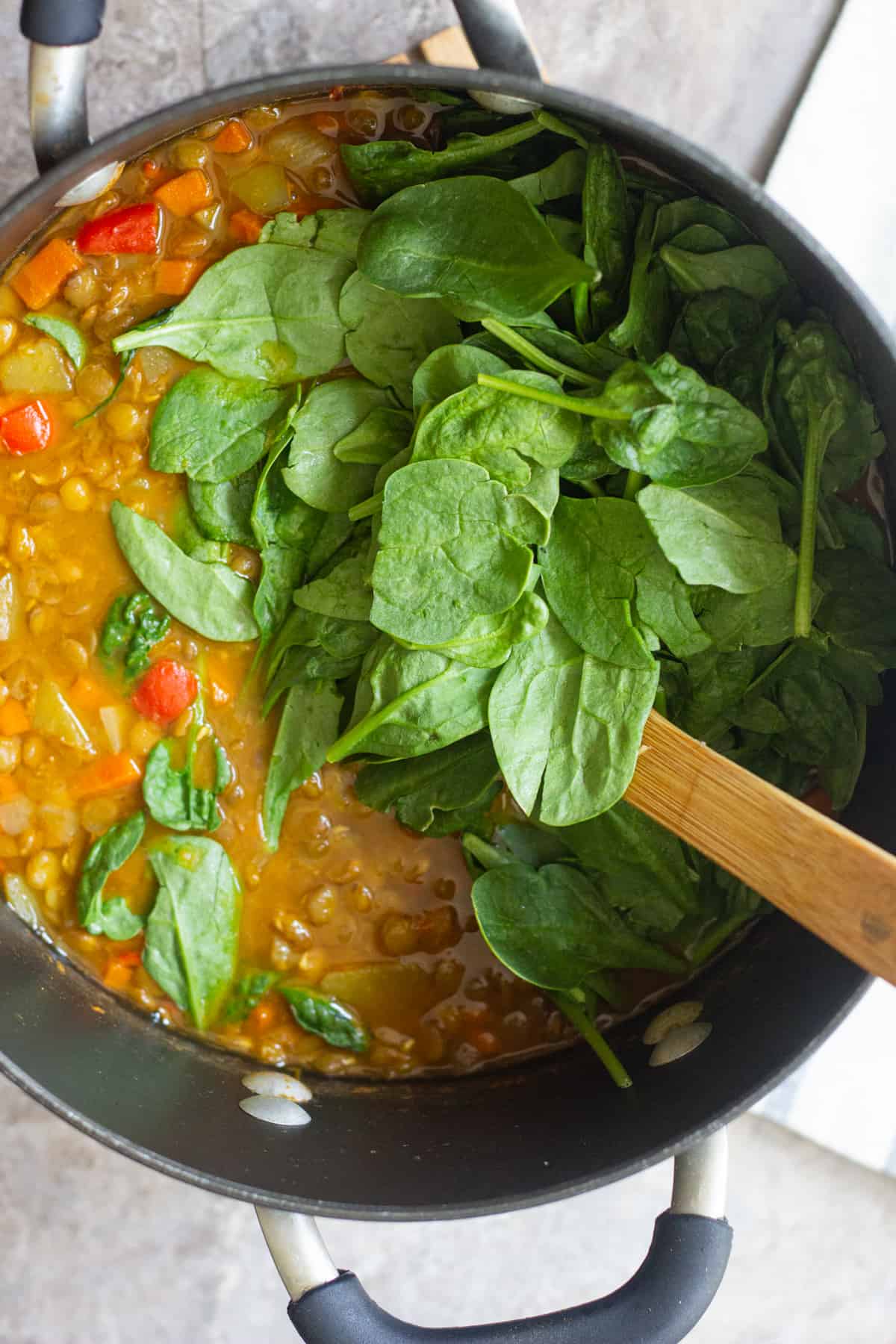 Add spinach to the soup at the last minute and stir just enough for the leaves to wilt.