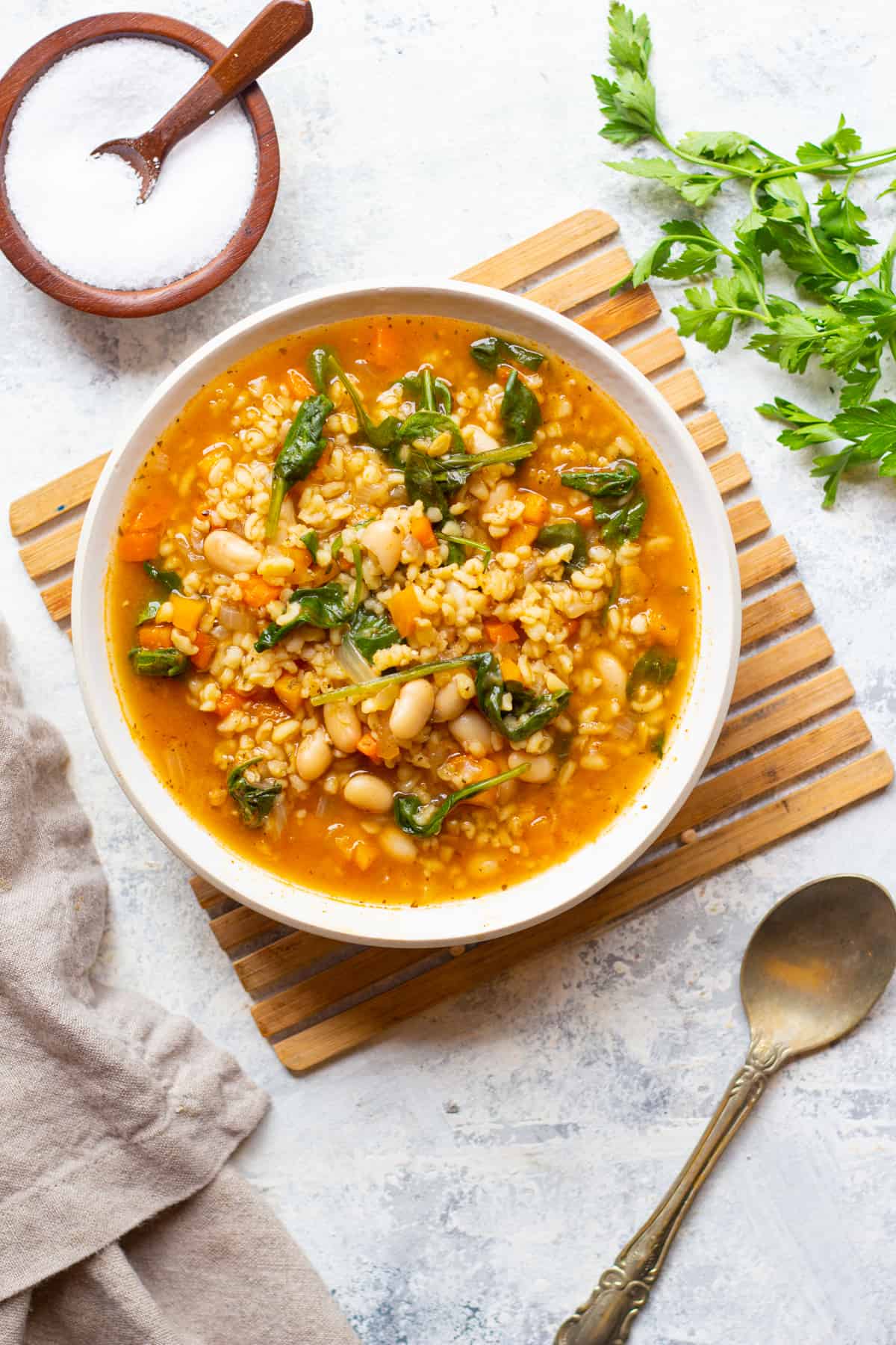 a bowl of vegan soup made in instant pot on a white surface. 