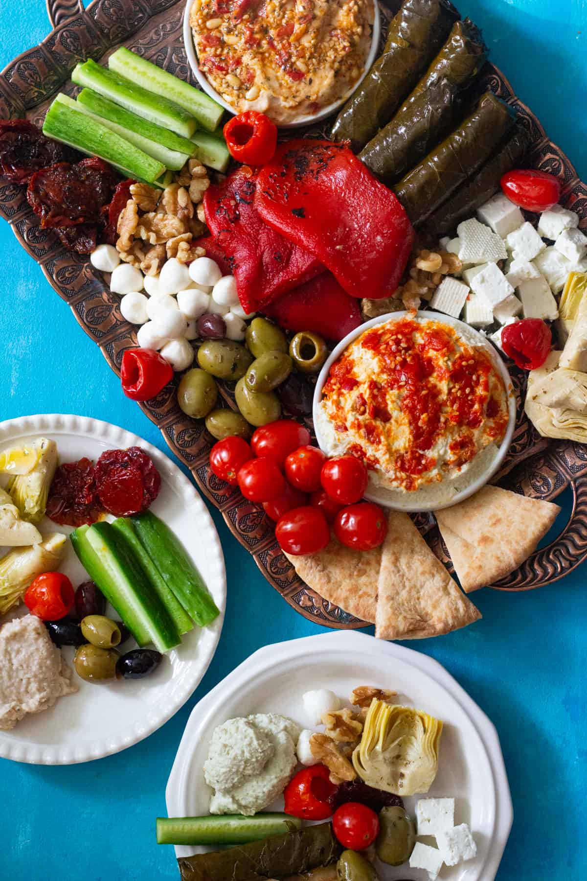 Mezze platter takes your appetizer game to a whole new level. This Mediterranean platter is a showstopper at any gathering and it's so simple to make.
