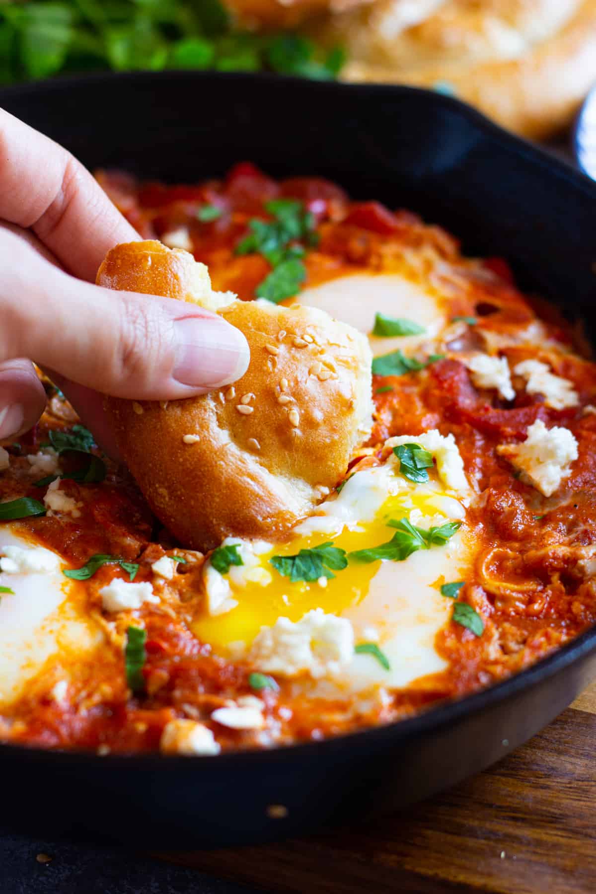 Shakshuka with feta is great for brunch. Eggs are poached in a delicious tomato sauce flavored with warm spices and vegetables and then topped with creamy feta. Learn how to make this easy one skillet breakfast recipe and enjoy it any day of the week.
