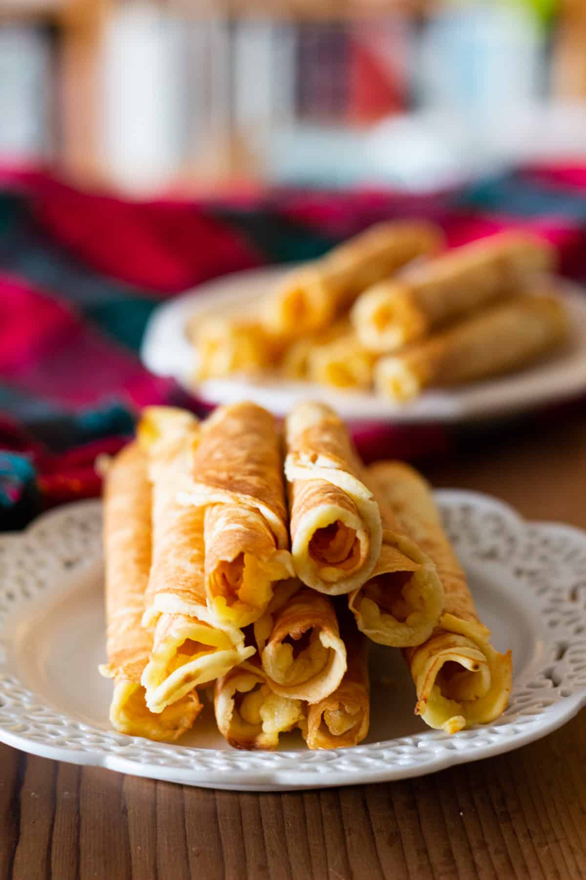Krumkake is a delicate Norwegian cookie that is loved across generations. It's decadent, delicious and worth every minute spent making it! Krumkake is a delicate Norwegian cookie that is loved across generations. It's decadent, delicious and worth every minute spent making it!