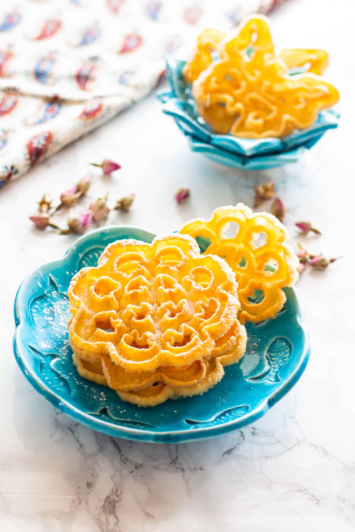 Nan Panjereh - Persian Rosettes is a traditional Persian cookie that is crisp and light. Once you find the technique, it is easy and fun to make!
