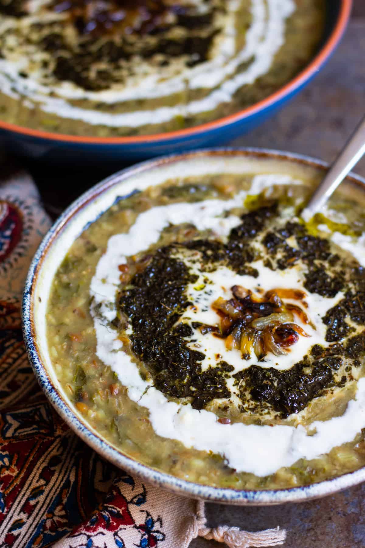 top the soup with sauteed mint, caramelized onion and whey yogurt. 