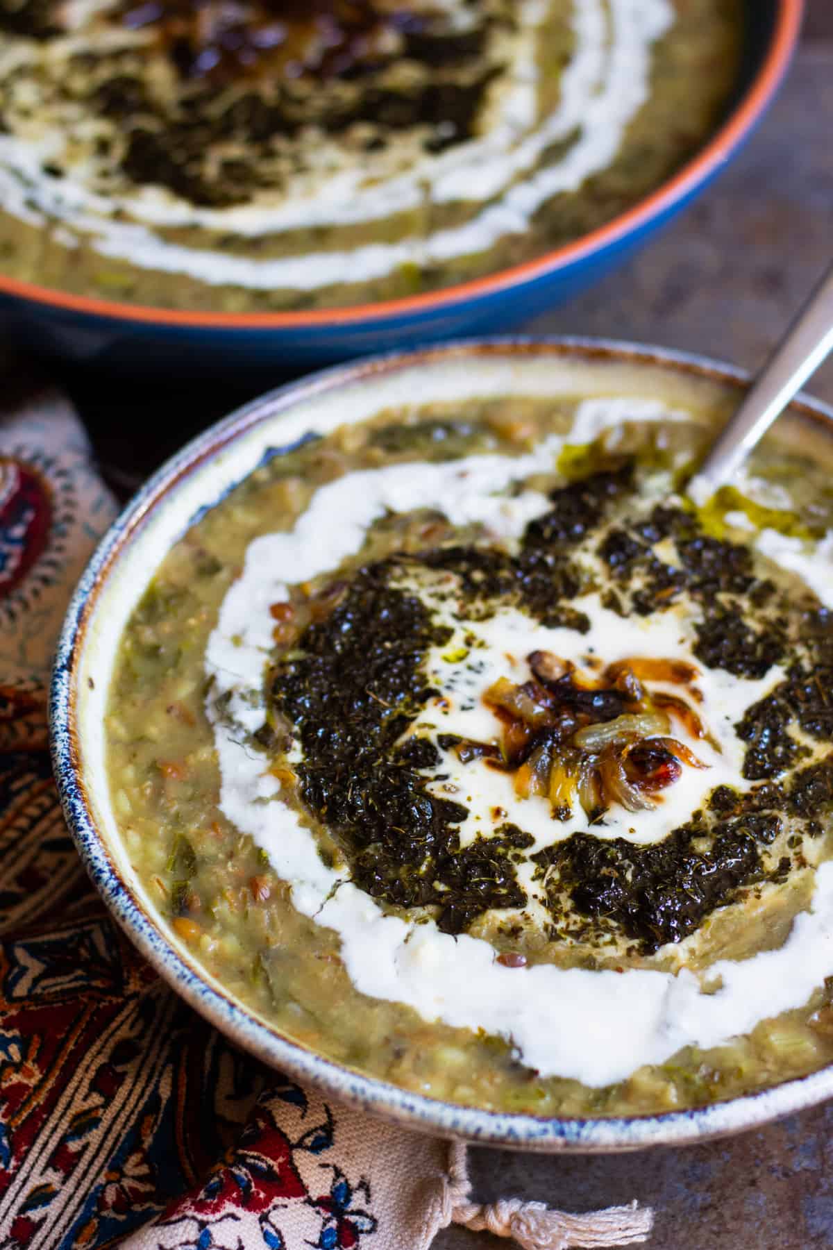 top the soup with sauteed mint, caramelized onion and whey yogurt.