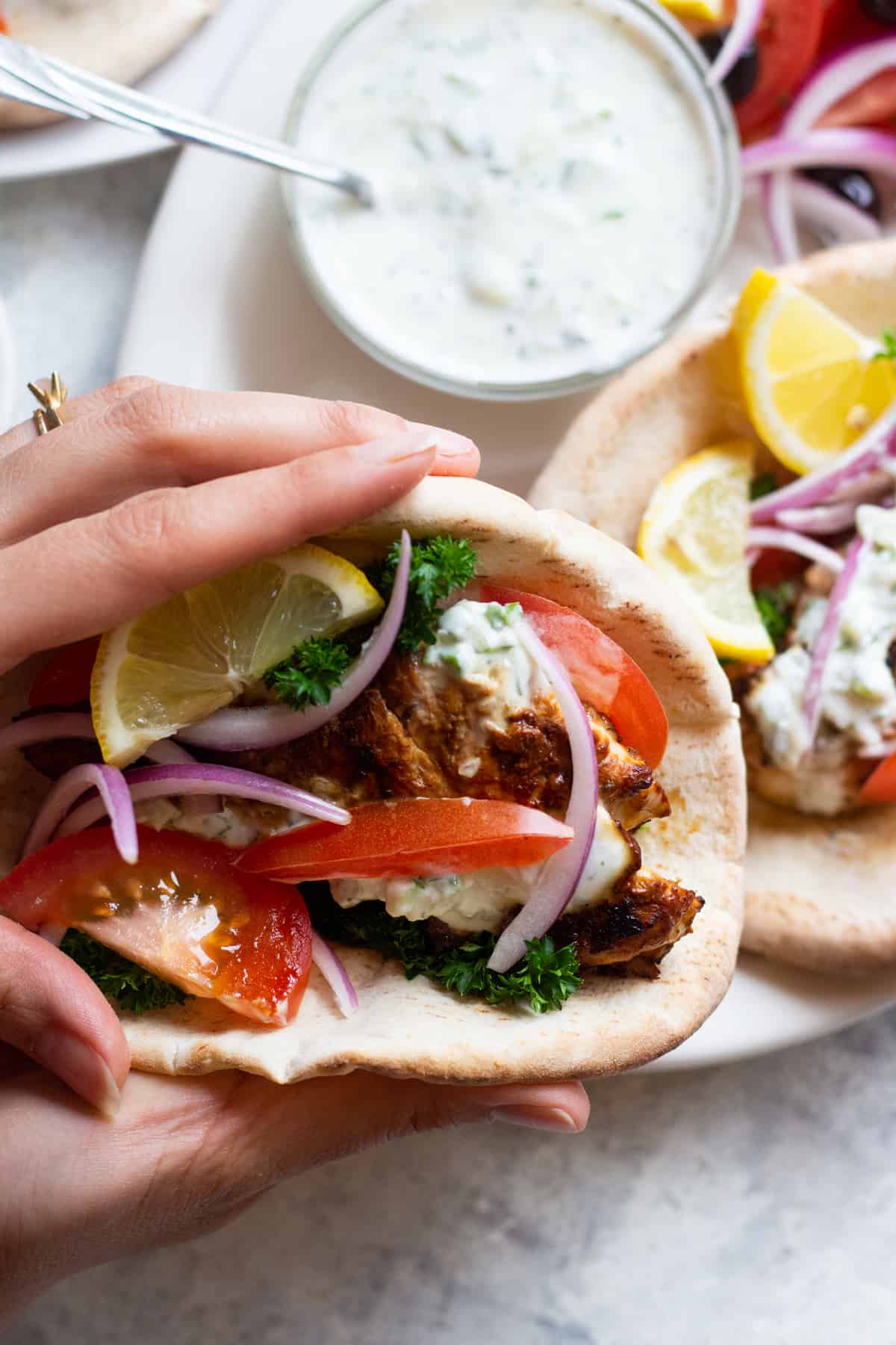 This chicken gyro recipe is easy and exceptionally delicious. The marinade makes the chicken extra flavorful and juicy. Stuff it into a pita with fresh veggies and homemade tzatziki for a fabulous Greek deliciousness!
