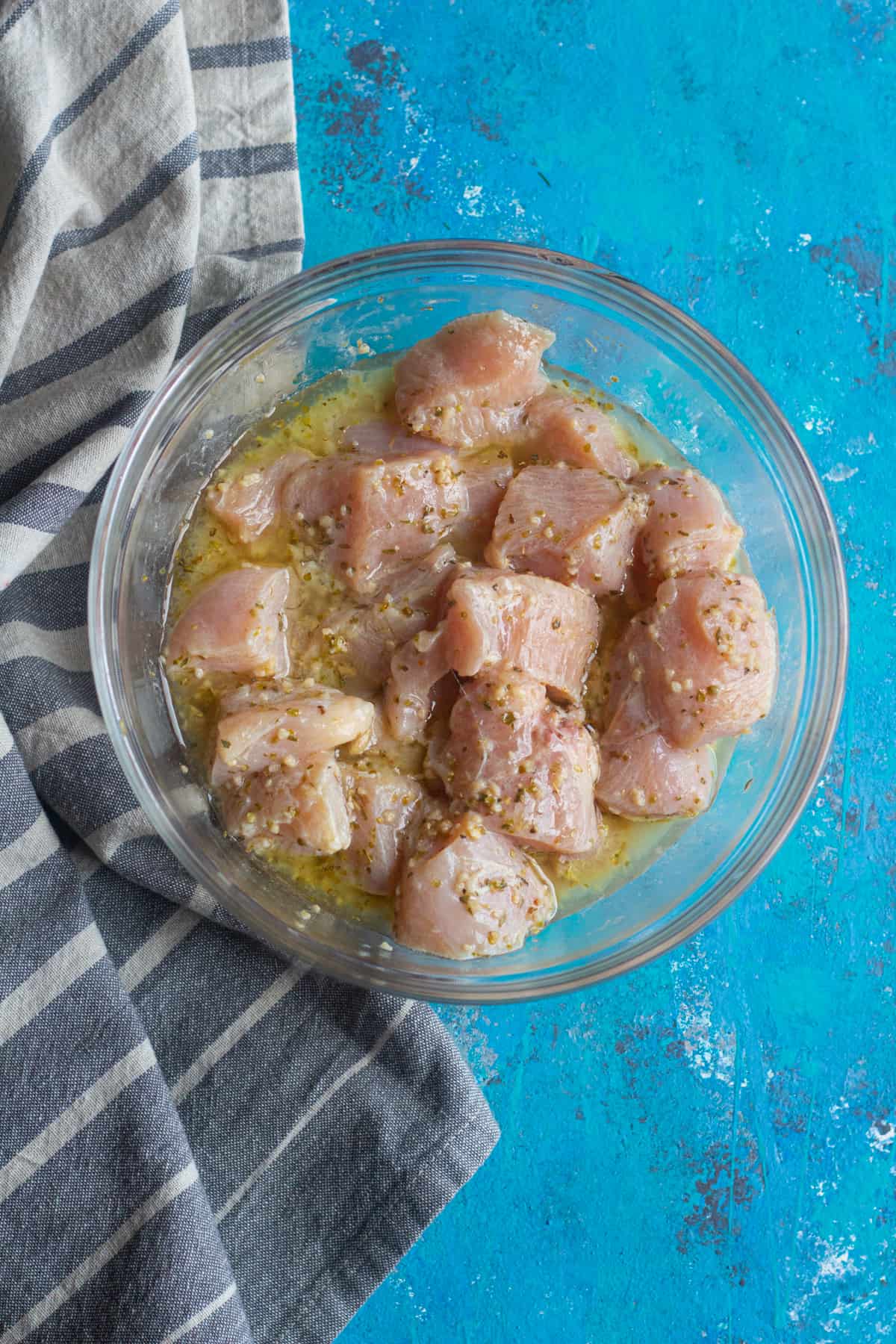 cut chicken into bite size pieces and mix it with olive oil lemon juice and spices. Marinade for at least one hour. 