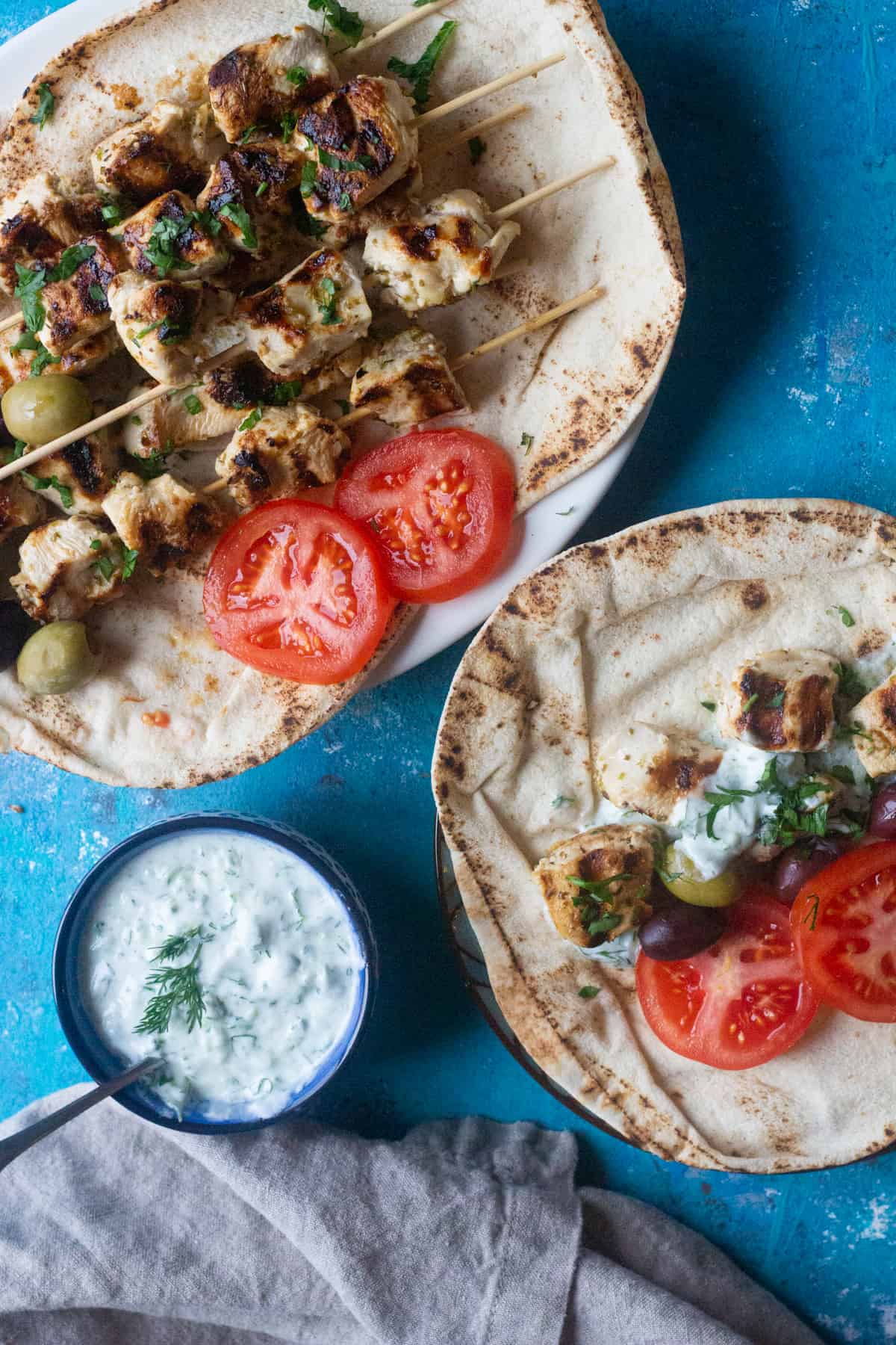 This Greek dish is served with pita. tomatoes and tzatziki sauce. 