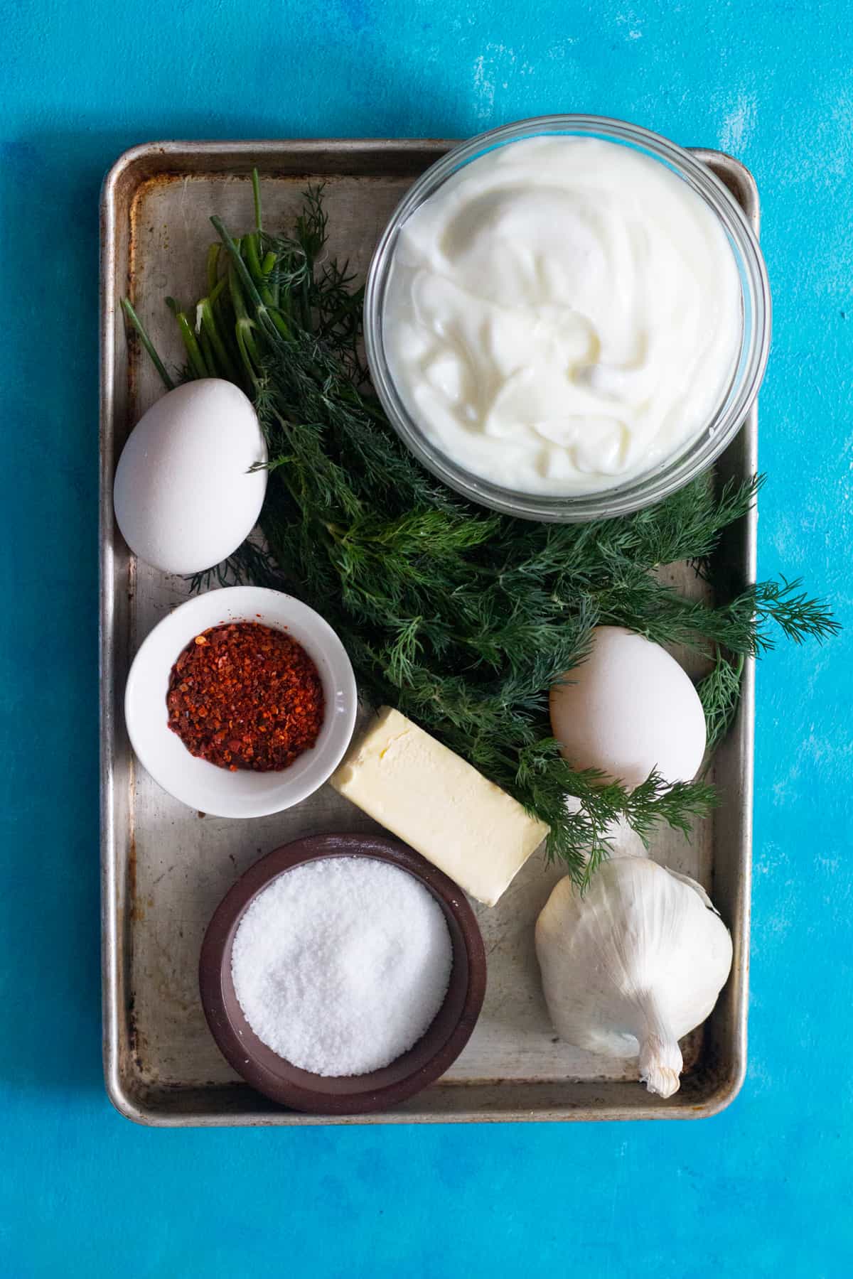 You need Eggs Plain yogurt Fresh or dried dill Garlic Salt and pepper Butter Aleppo Pepper to make cilbir turkish eggs.