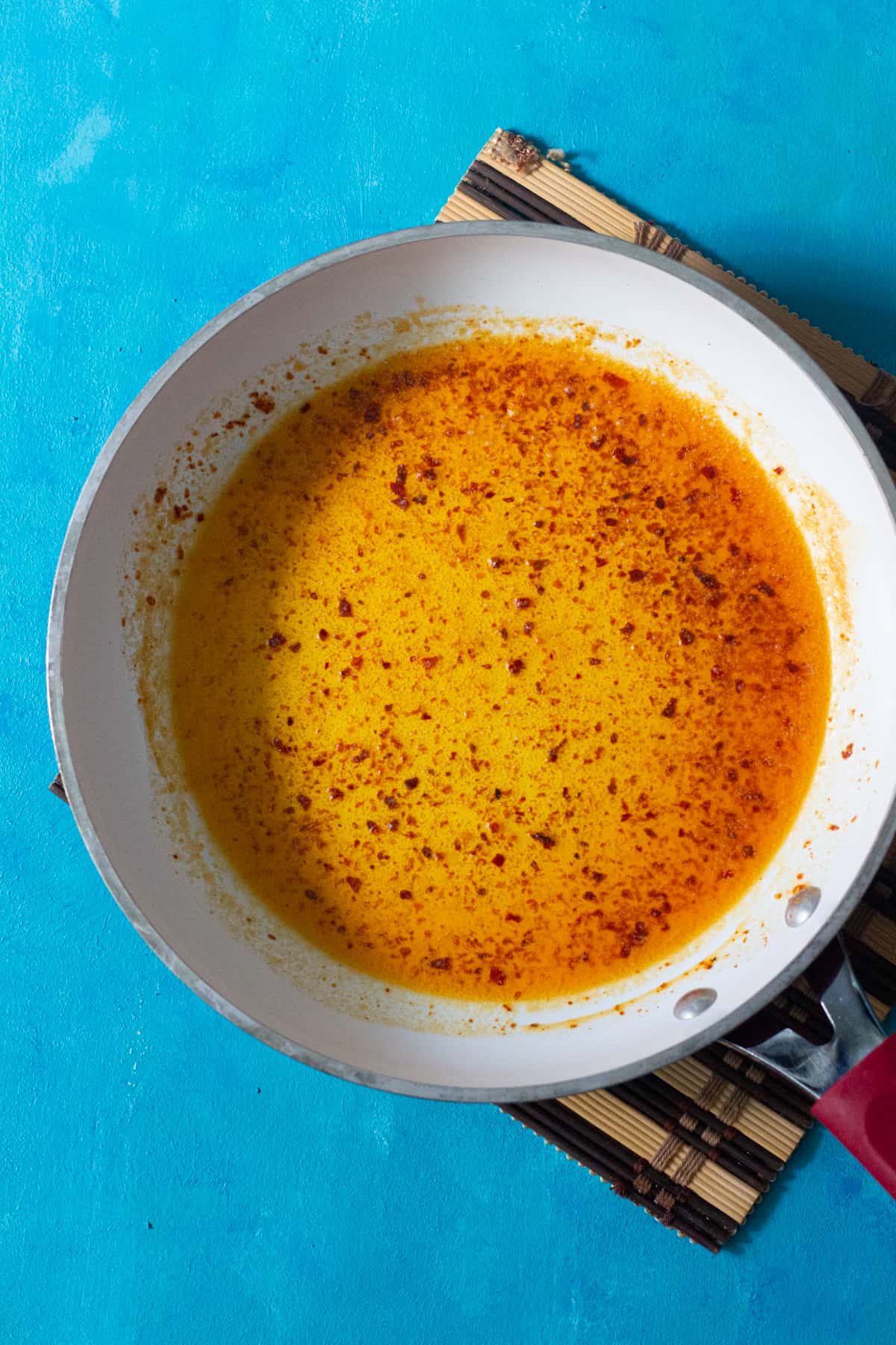 Melt butter in a small sauce pan and add Aleppo pepper to it. 