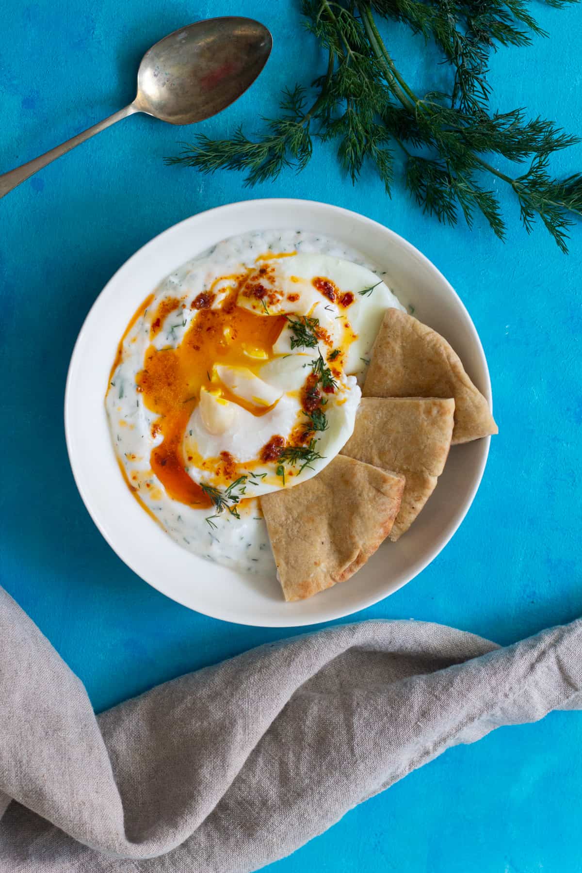 Cilbir Turkish eggs is delicious breakfast made with poached eggs.