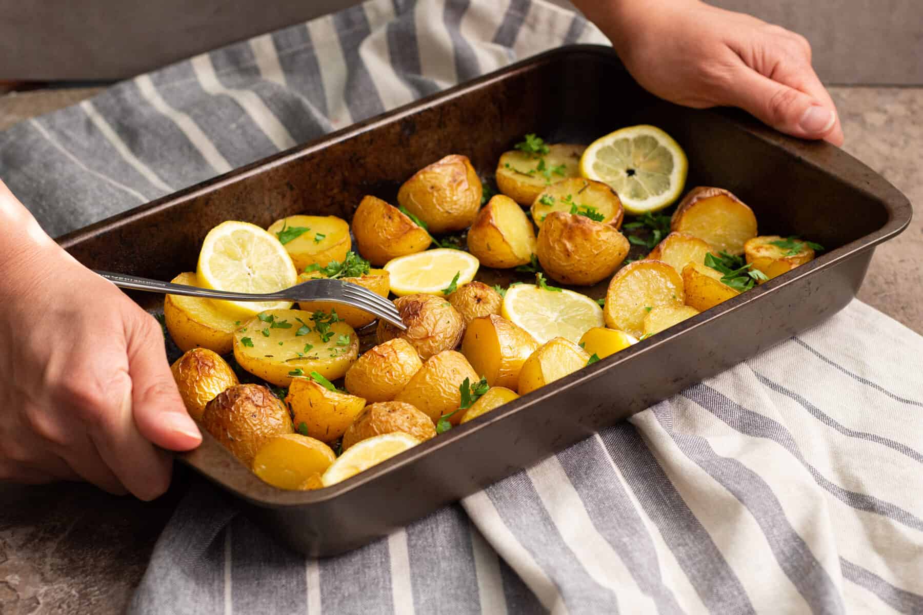 Serve Greek potatoes warm. These Greek potatoes are crispy on the outside and creamy on the inside.