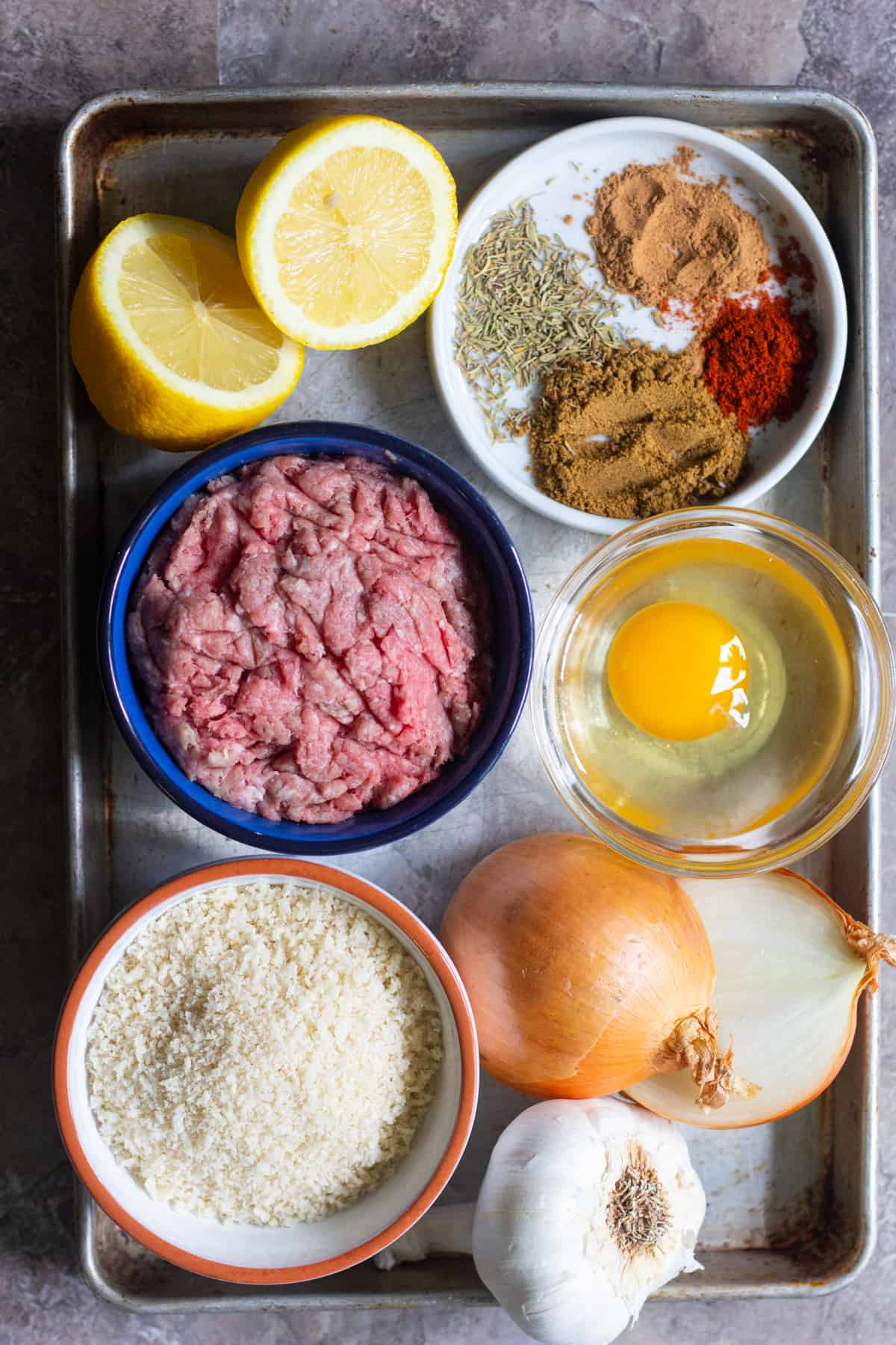 Greek meatballs are made of beef and lamb, egg, onion, bread crumbs, garlic, lemon and spices. 
