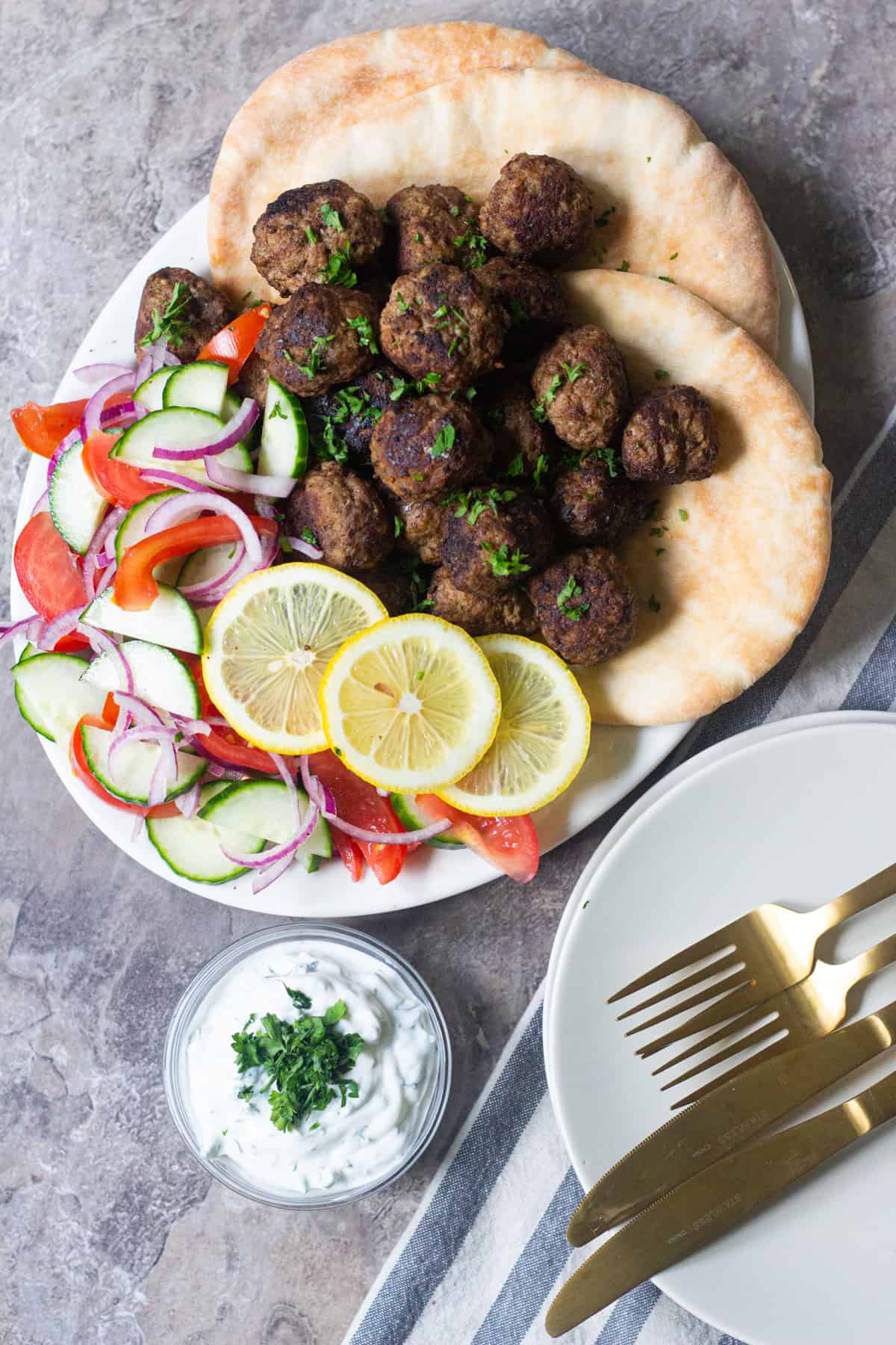 Keftedes are Greek meatballs that are juicy, delicious and easy to make. Serve them with some pita, salad and tzatziki for a complete Mediterranean meal!
