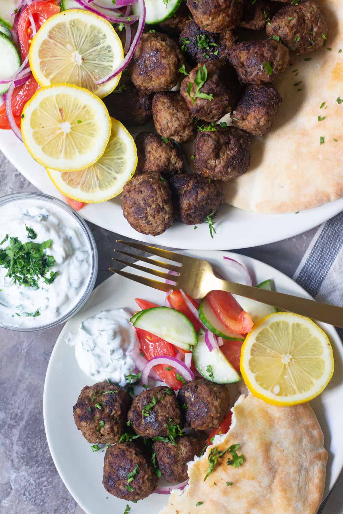 These Greek meatballs are the best meatballs ever! You can serve these delicious Greek meatballs as a crowd pleasing appetizer or a complete meal.