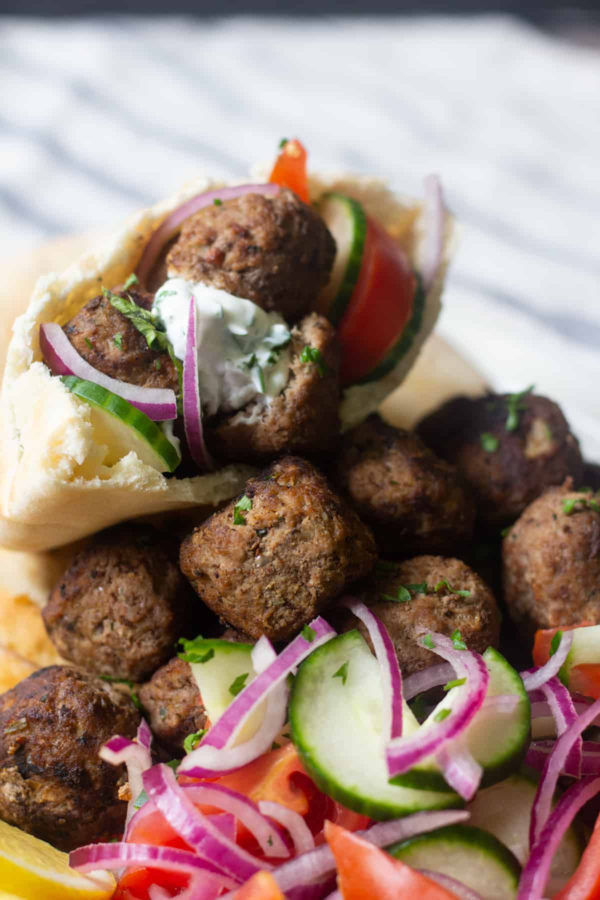 These tasty meatballs are easy to make and are perfect with vegetables such as onion, cucumbers and tomato. 