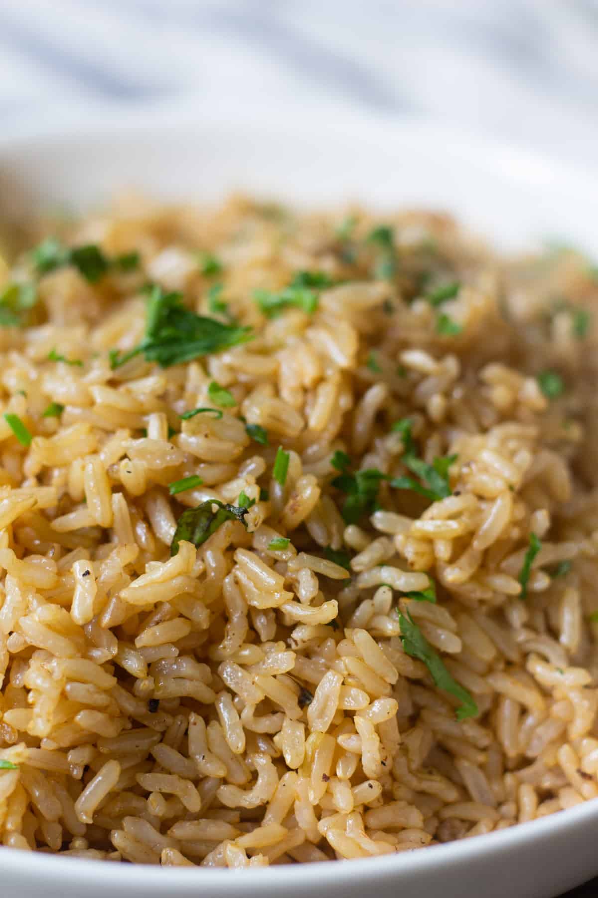 close up instant pot brown rice topped with parsley. 
