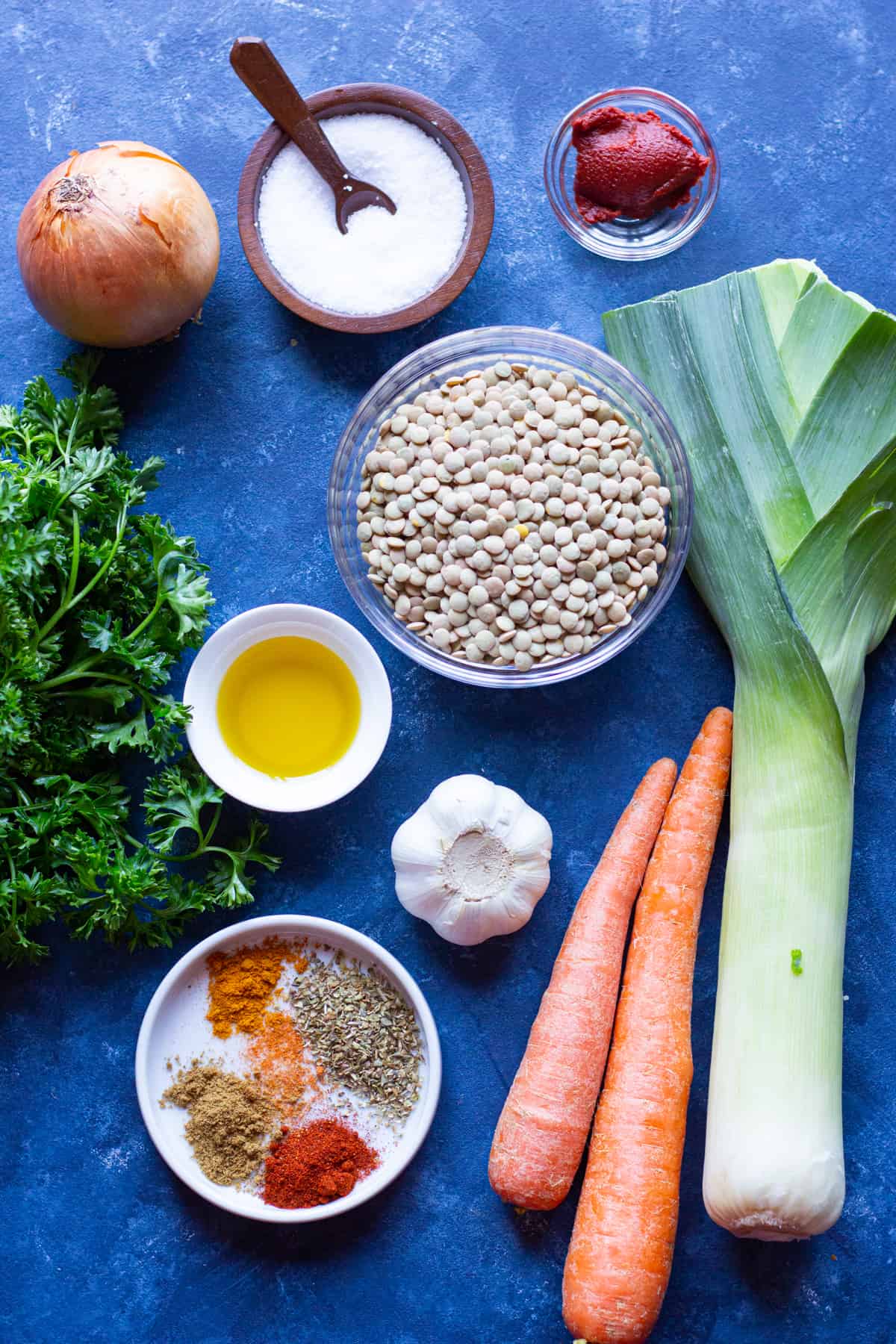 To make instant pot lentil soup you need lentils, tomato paste, onion, salt, olive oil, garlic, leek, carrots and spices.