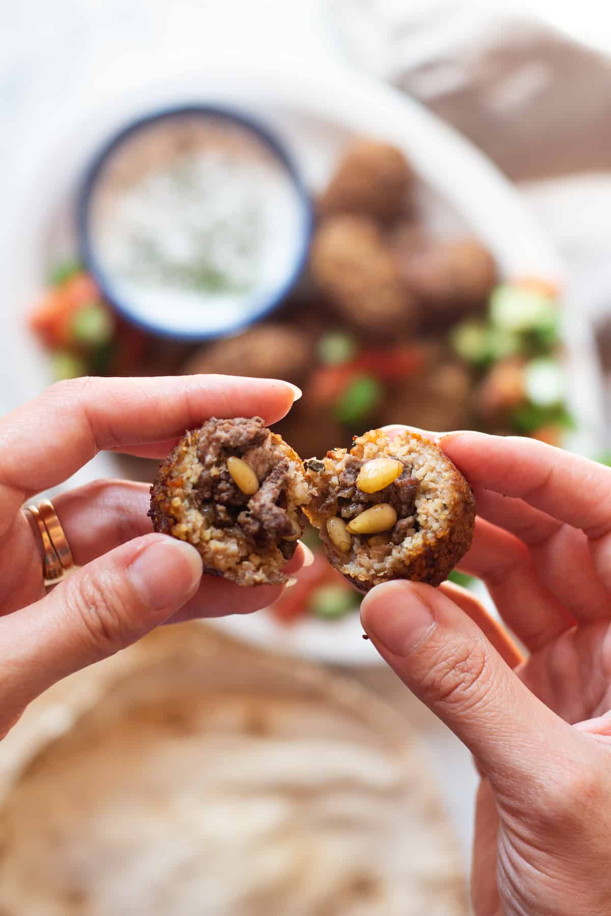 Inside of a fried kibbeh with ground beef, spices and pine nuts. 