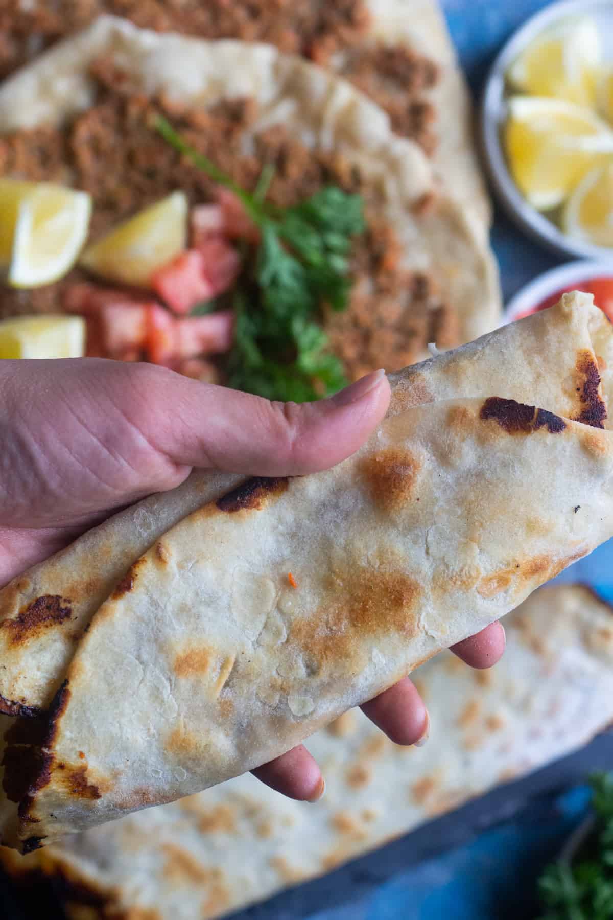 Serve it like a wrap served with parsley and tomatoes.